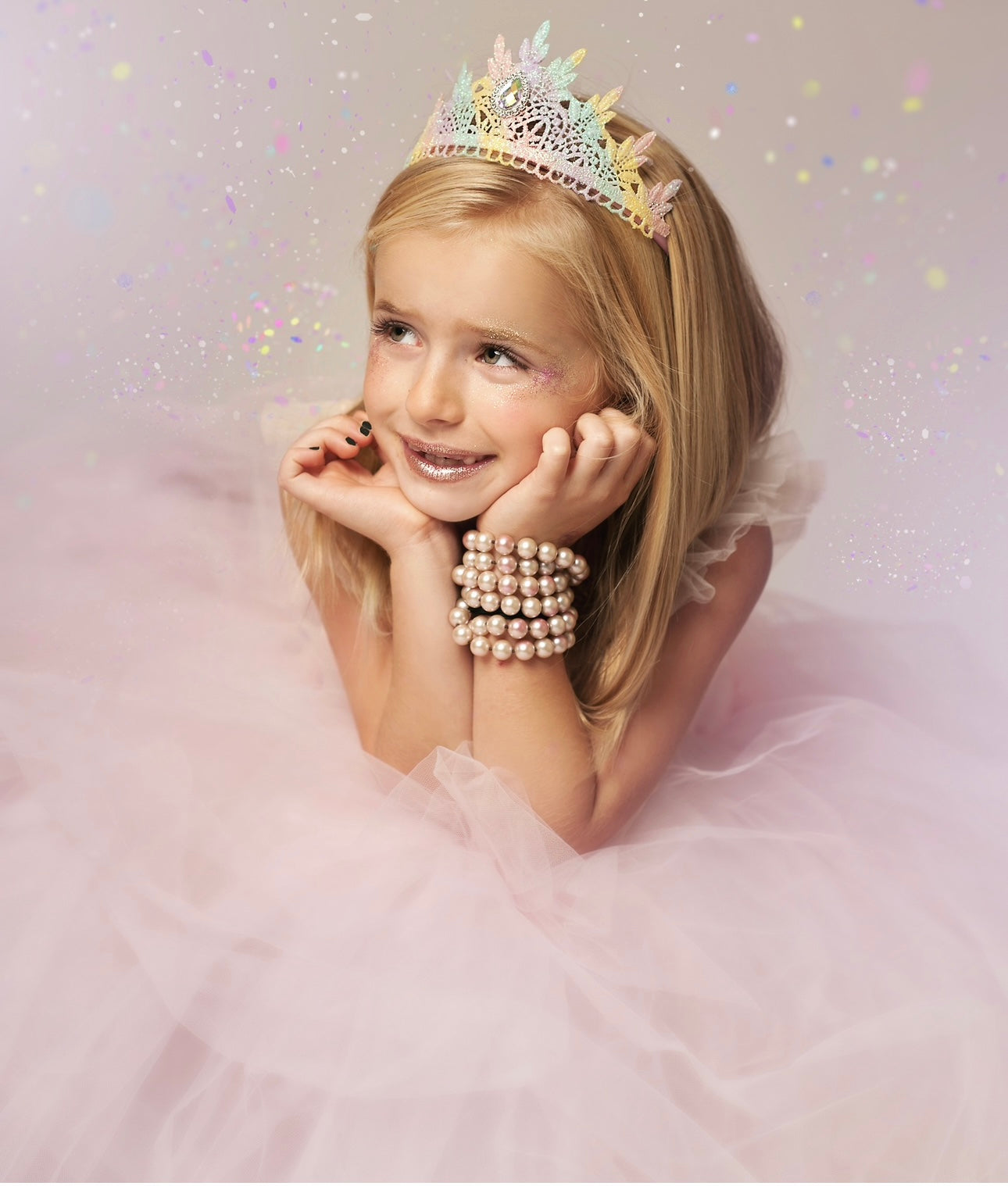 Young girl wearing a delicate Love Crush Crowns headpiece, radiating elegance and charm.