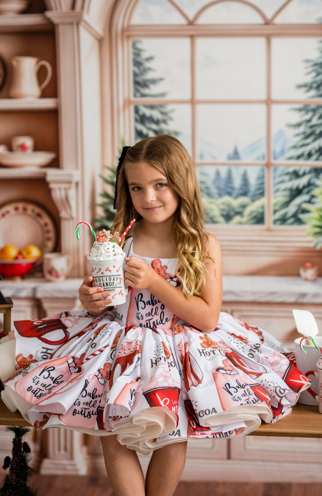 Girl in Hot Cocoa dress posing for holiday photo session
