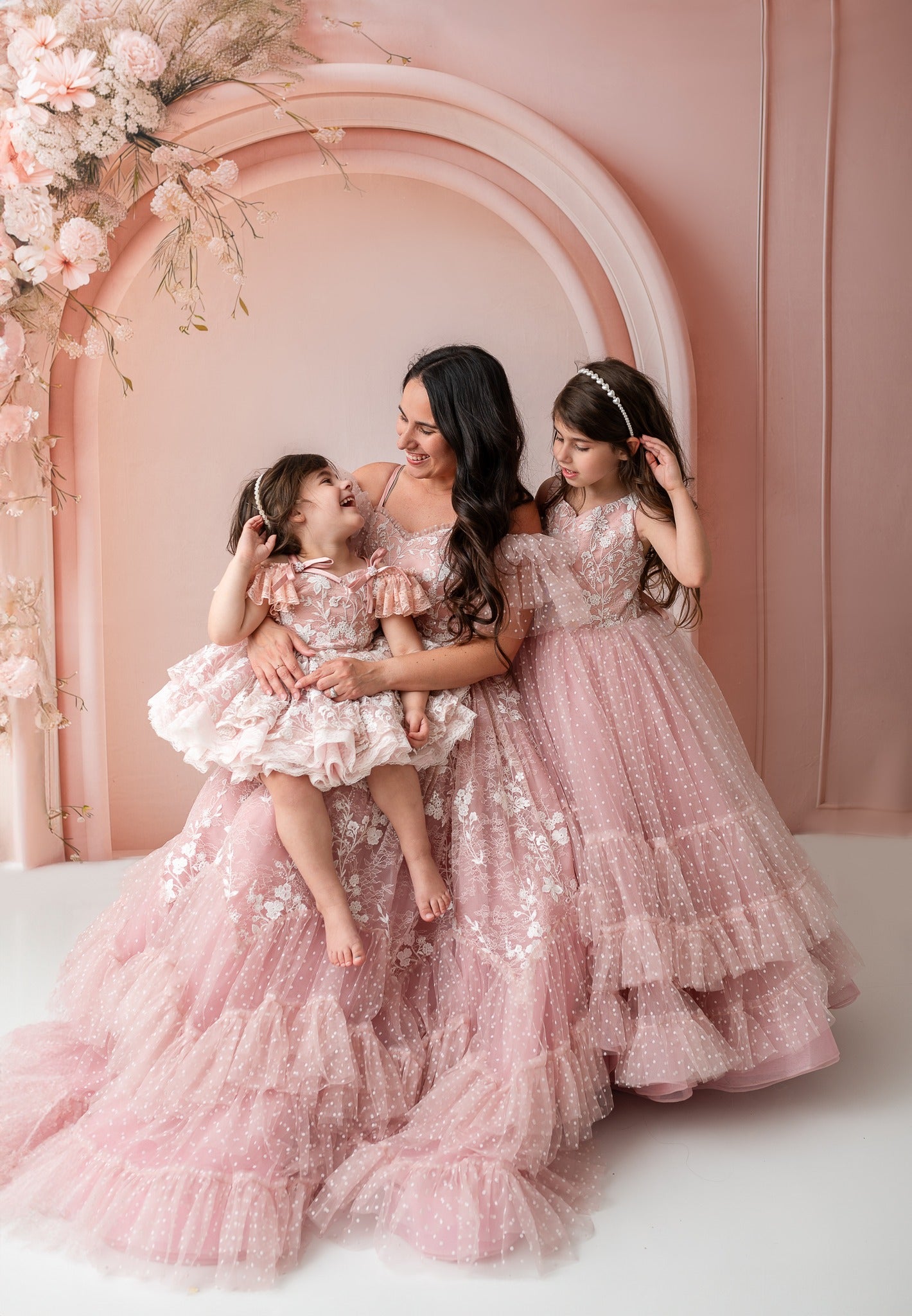 "Mother and daughter twinning in stunning gowns, designed for celebrations and photoshoots."