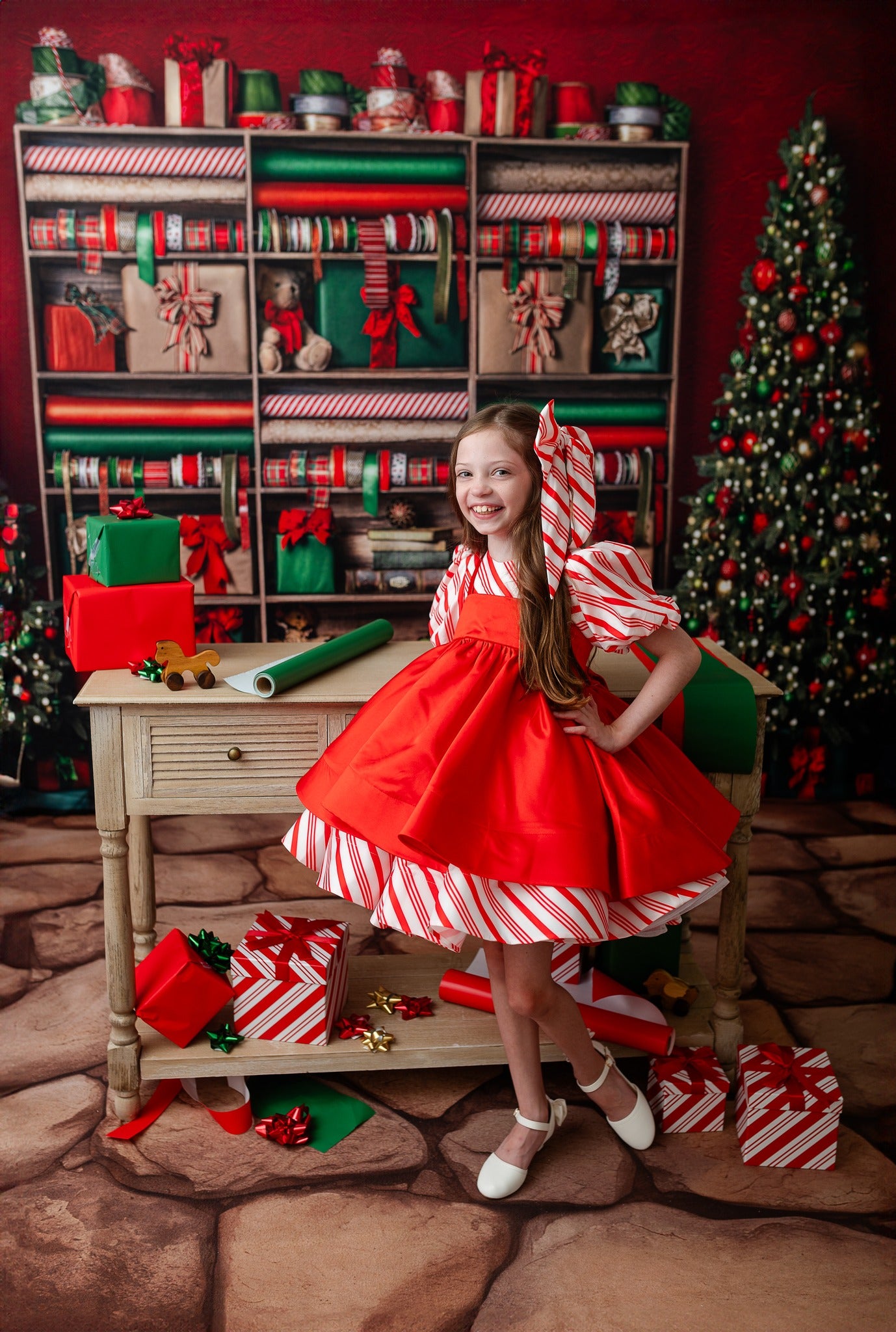 girl wearing a candy cane themed dress