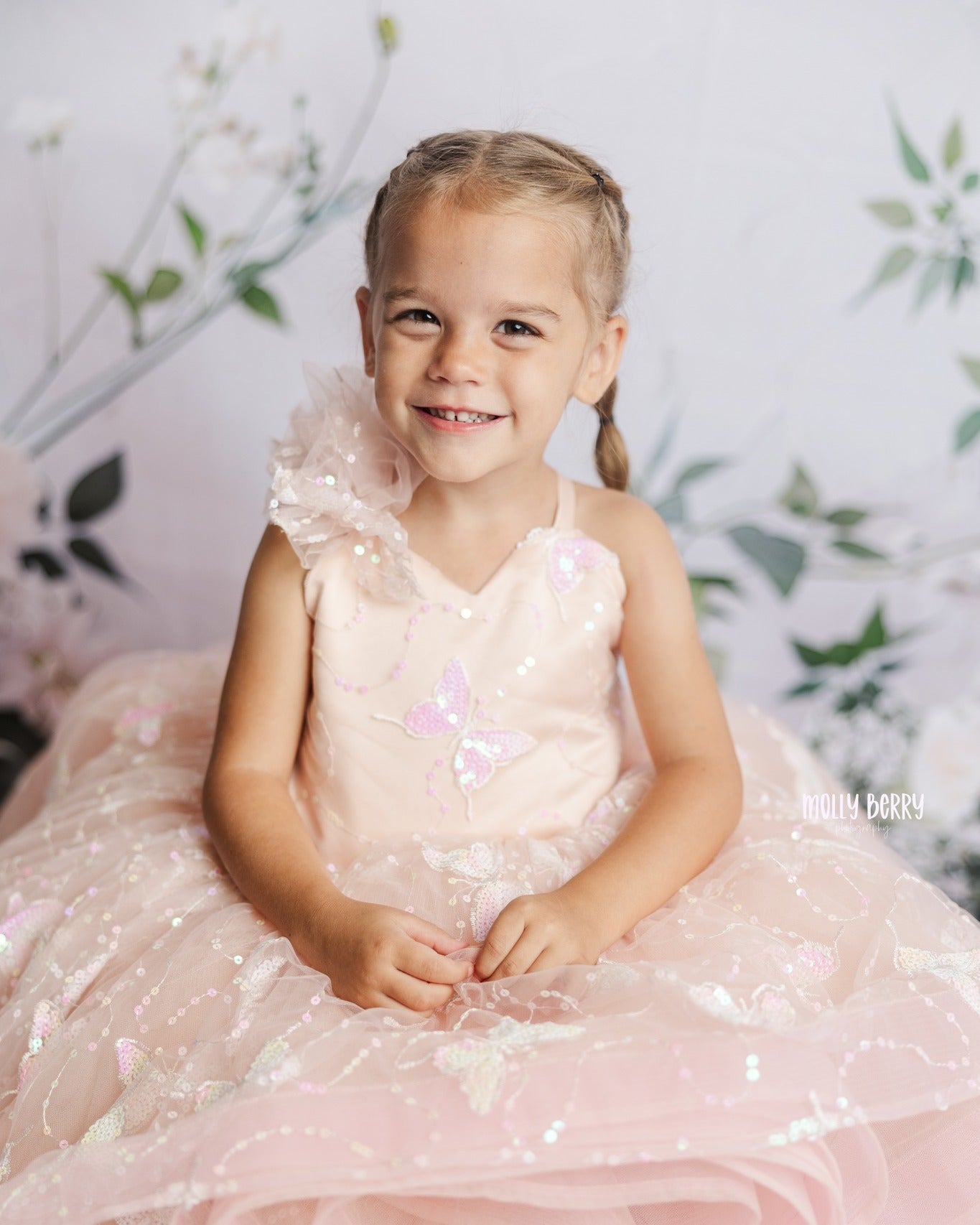"Front view of the Anastasia gown, designed with a sequin-embroidered high-low skirt and a built-in petticoat for added fullness."