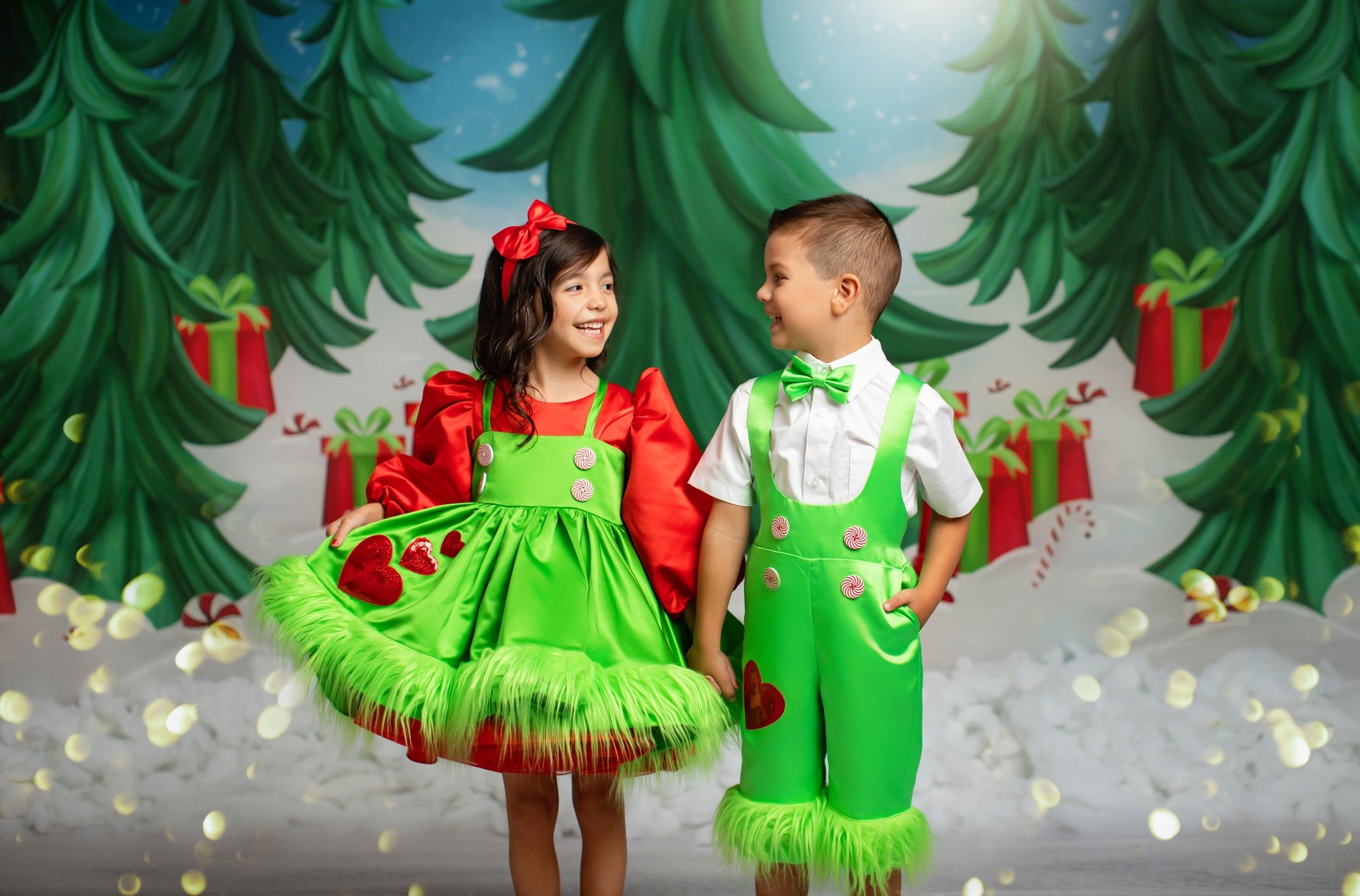 Christmas-themed children’s fashion with bold green, red accents, and festive embellishments, styled for a holiday photoshoot.