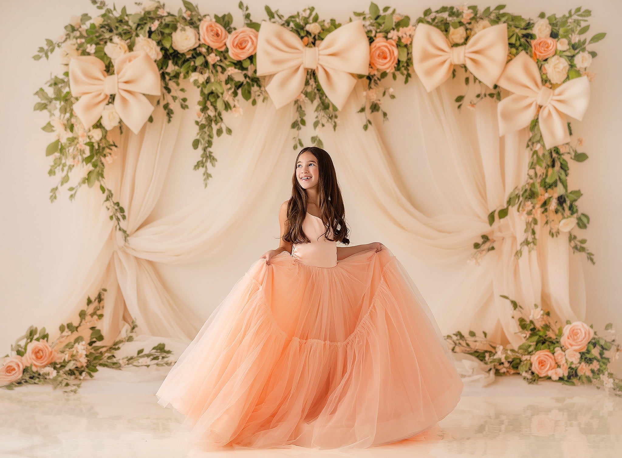 "Elegant peach-pink couture gown with train displayed against white backdrop"