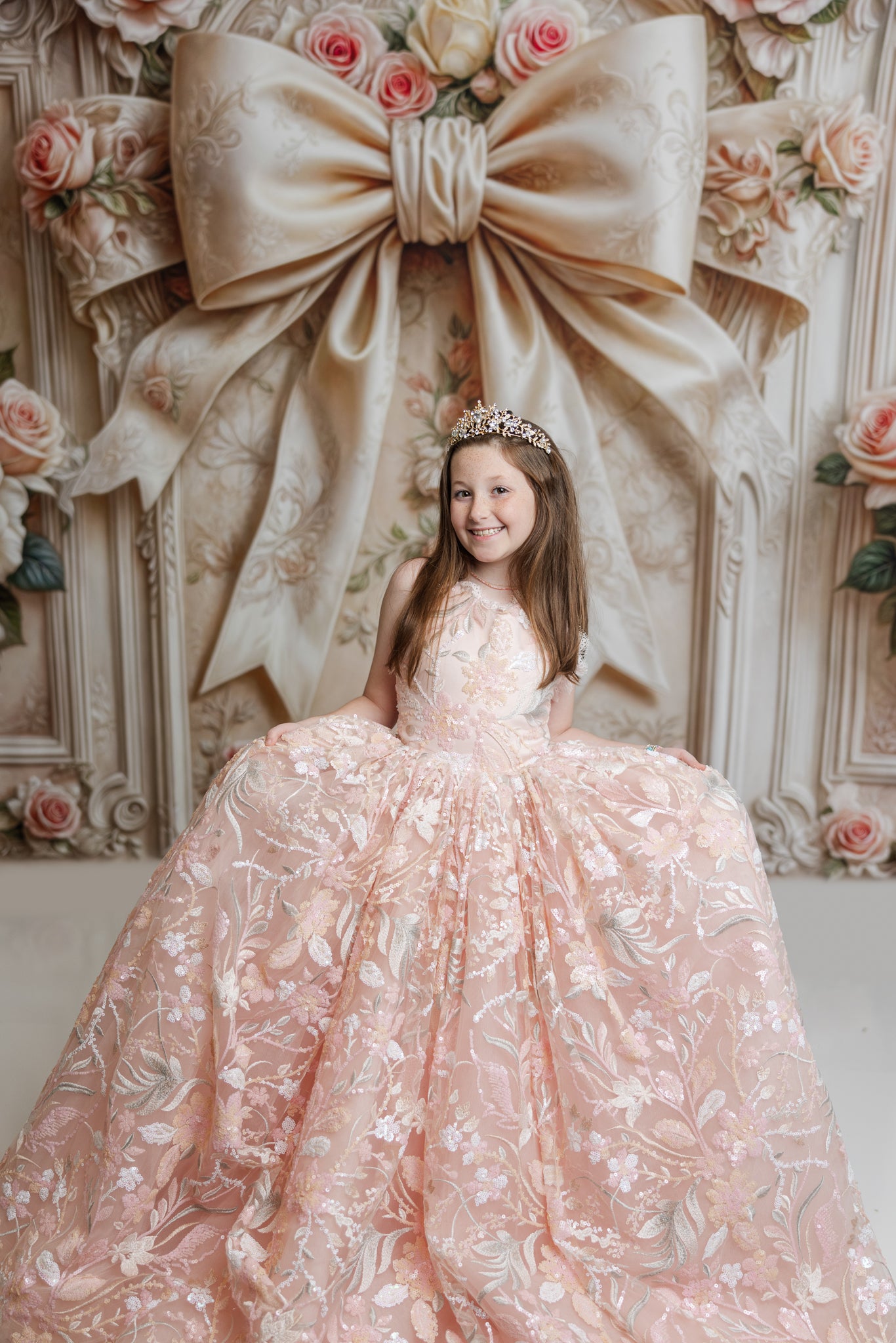 "Peachy pink Marley gown with sequin details and floral lace trim, perfect for spring photography sessions."