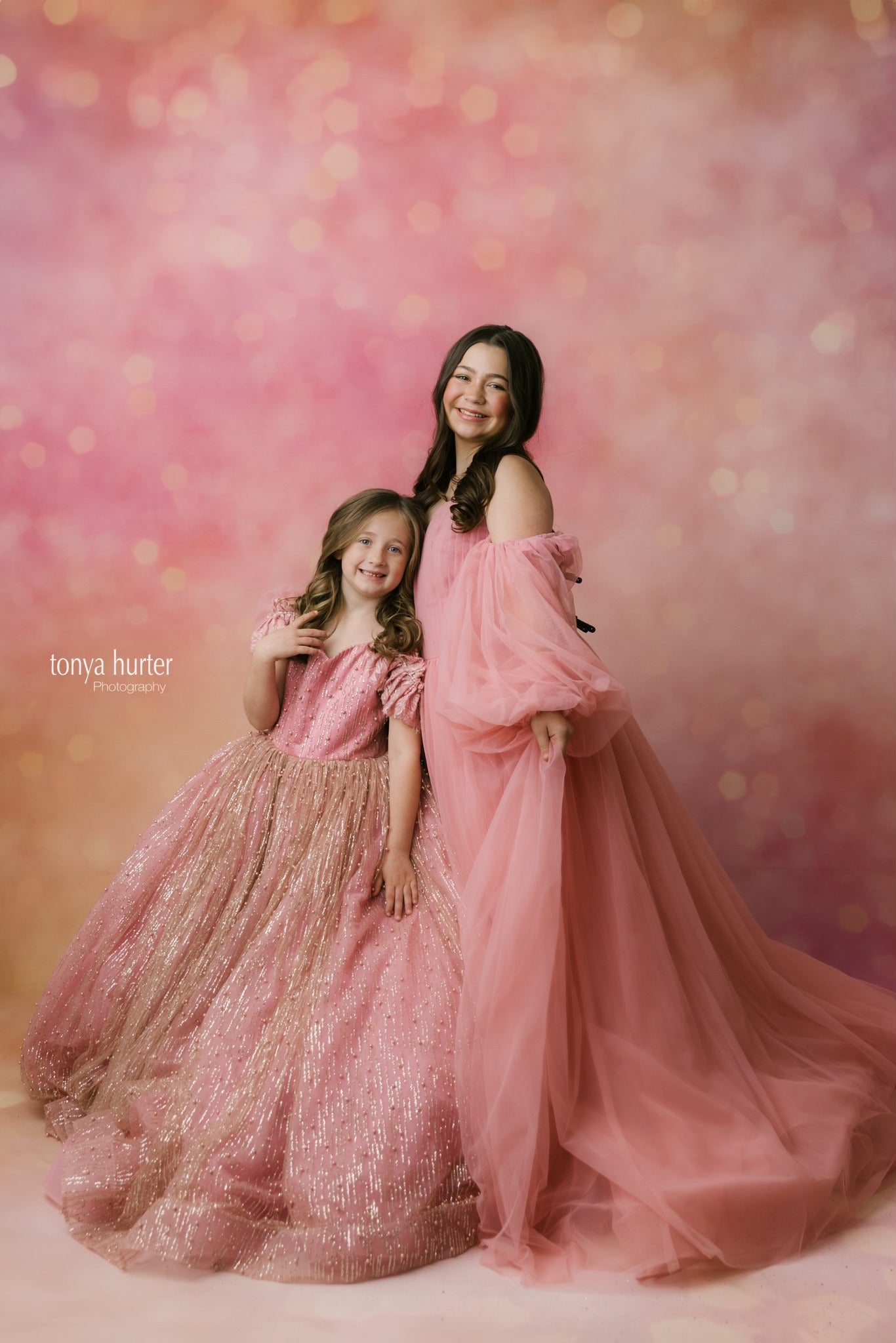 Rosewater Radiance Tulle Gown with delicate pink layers, perfect for spring photoshoots.