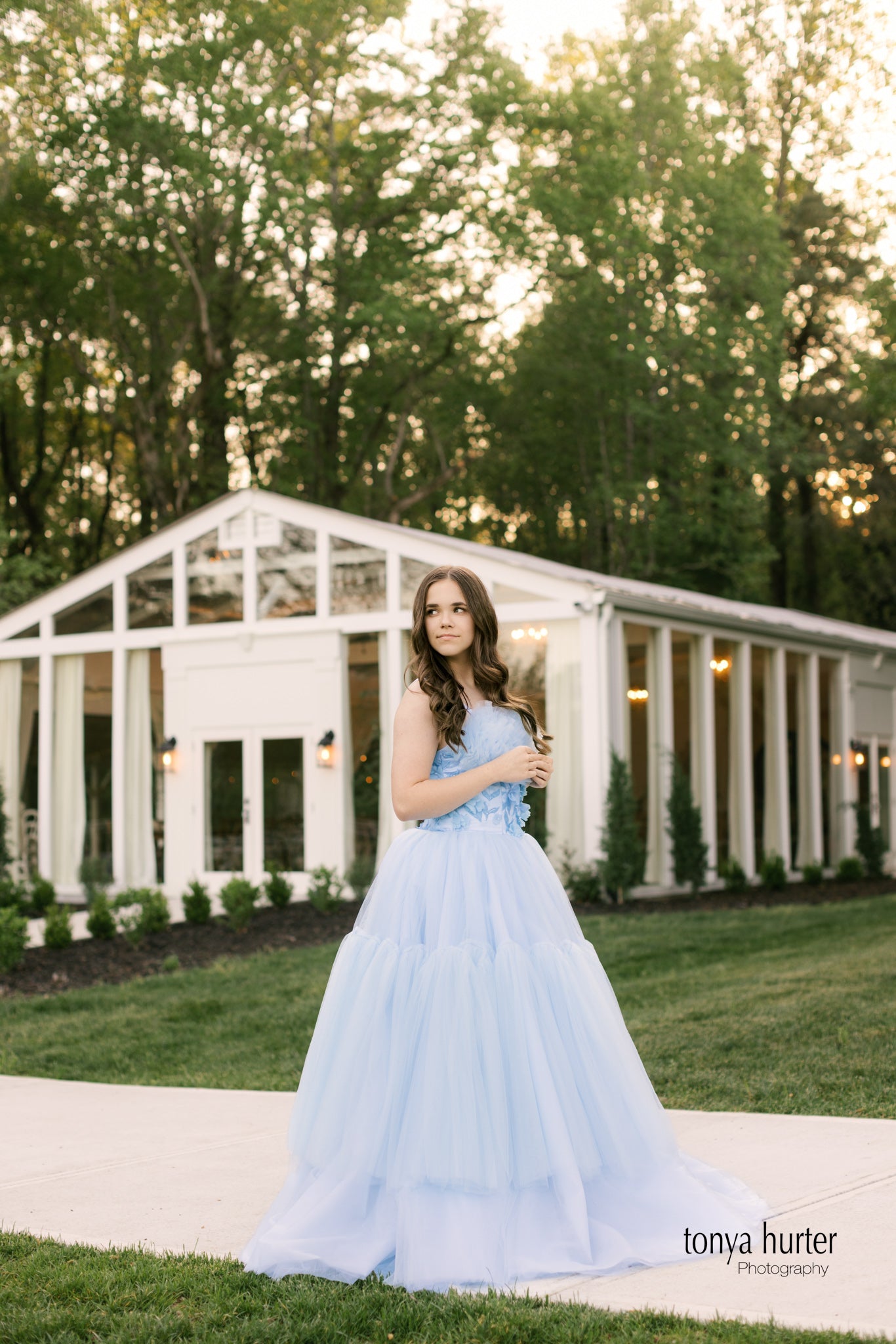 Elegant floor-length gown featuring cascading layers of soft tulle and adjustable shoulder ties, designed for adults sizes 0 to 4.