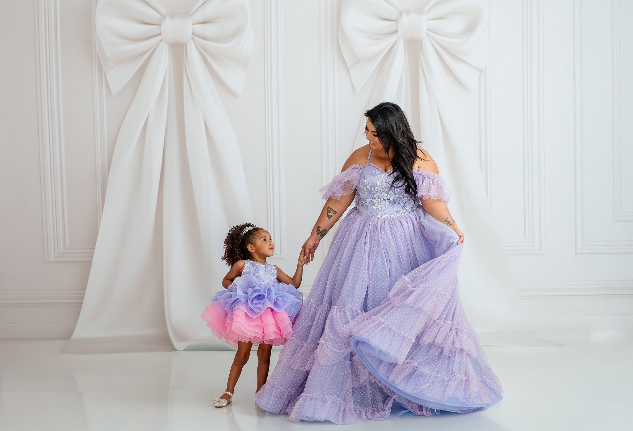 Timeless lace gown in soft lilac, perfect for photoshoots and special occasions.
