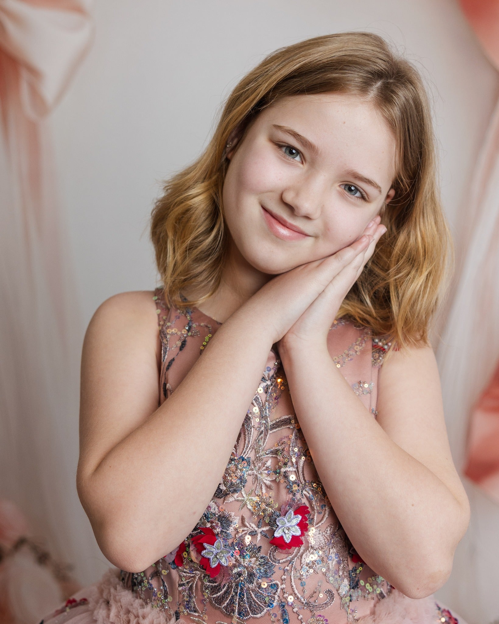 Little girl wearing a couture rental dress in a fairytale-inspired setting
