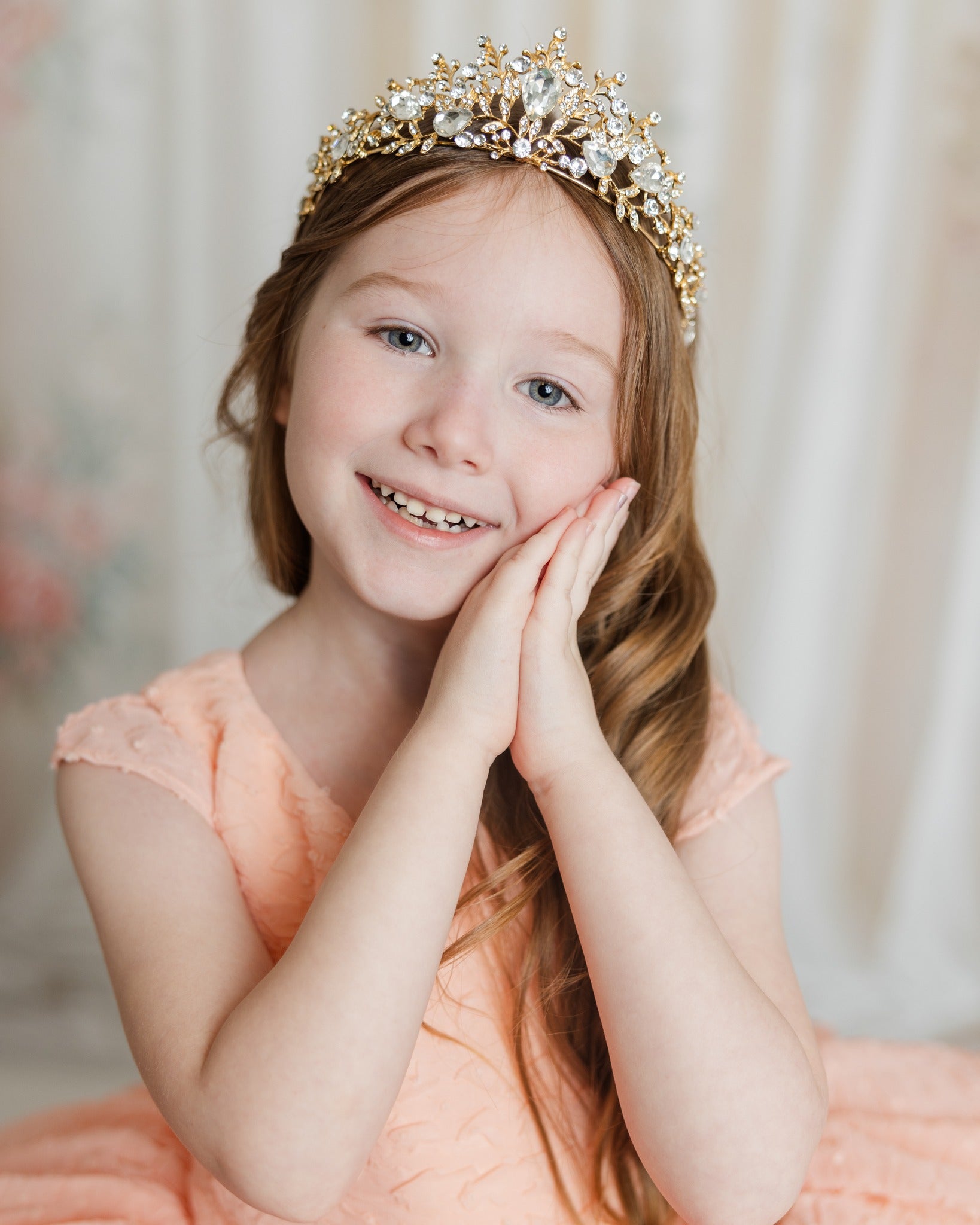 Styled children’s photography session with girl posing in a pastel designer gown