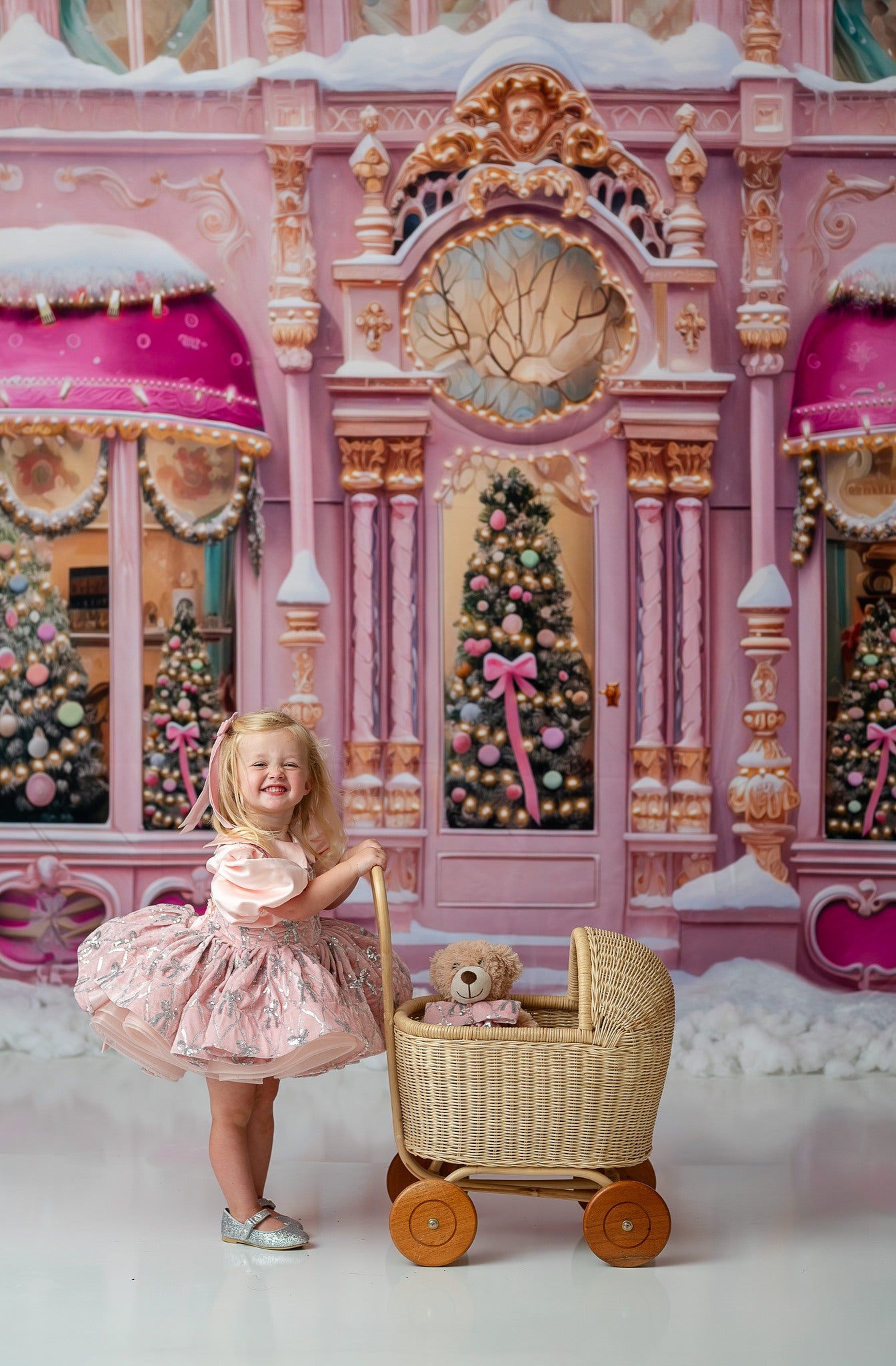 "Editorial-style portrait of a child wearing the Velvet Whimsy Bows Apron Dress, featuring a soft velvet skirt and silver embroidered bows, styled with a puff sleeve detachable bodice."