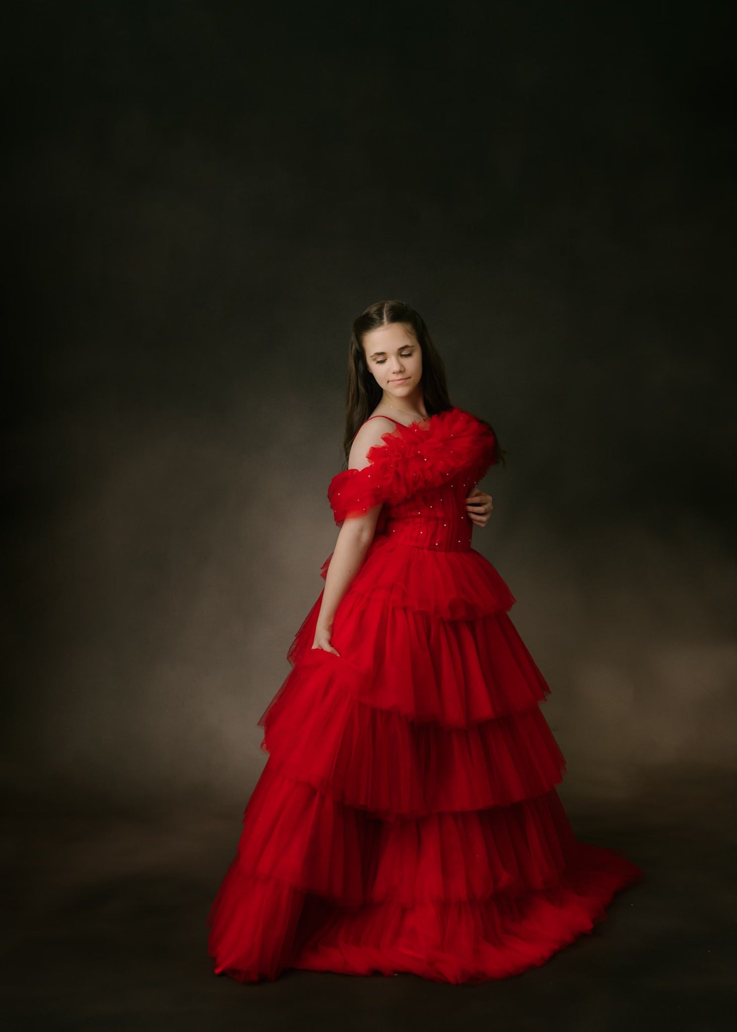 "Portrait-ready couture gown for girls in romantic lace and flowing skirt design"