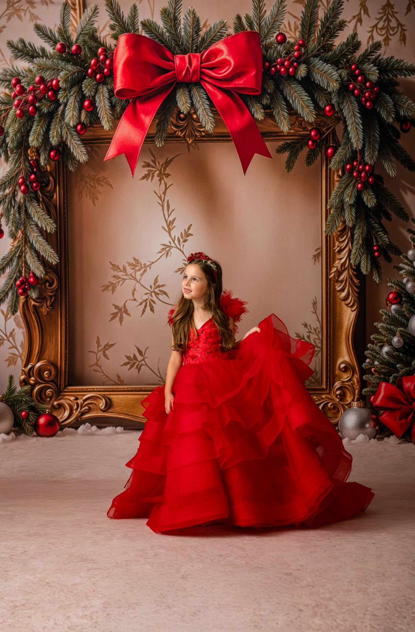 Little girl posing in Sadie gown with 3D red sequin bodice during a photography session.