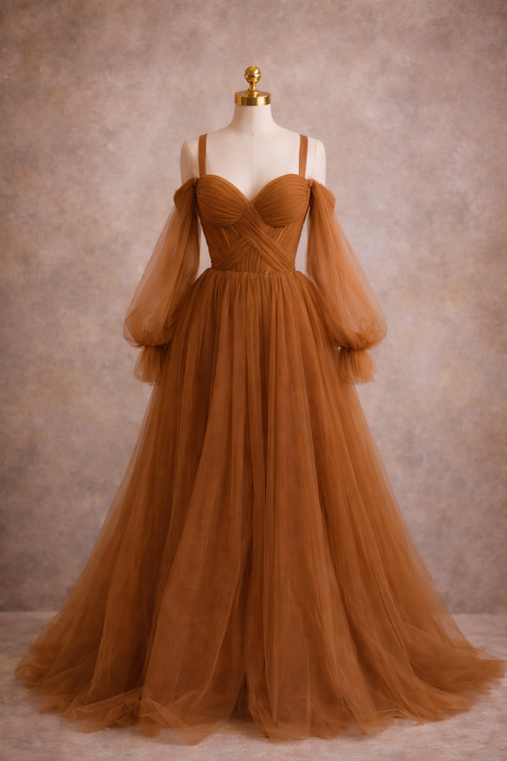 Brown evening gown on a mannequin against a neutral background