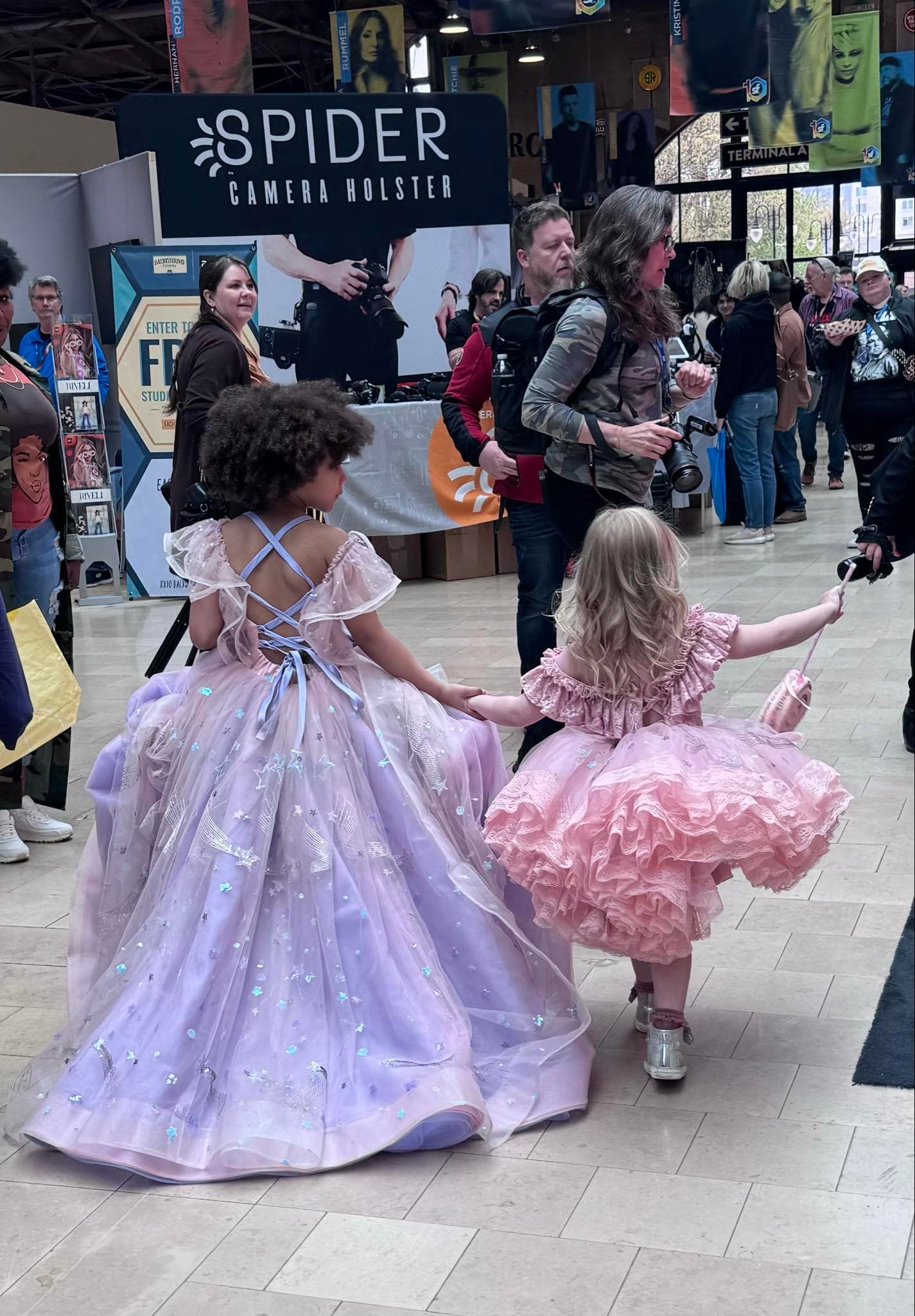 Cute little girls walking in couture gowns