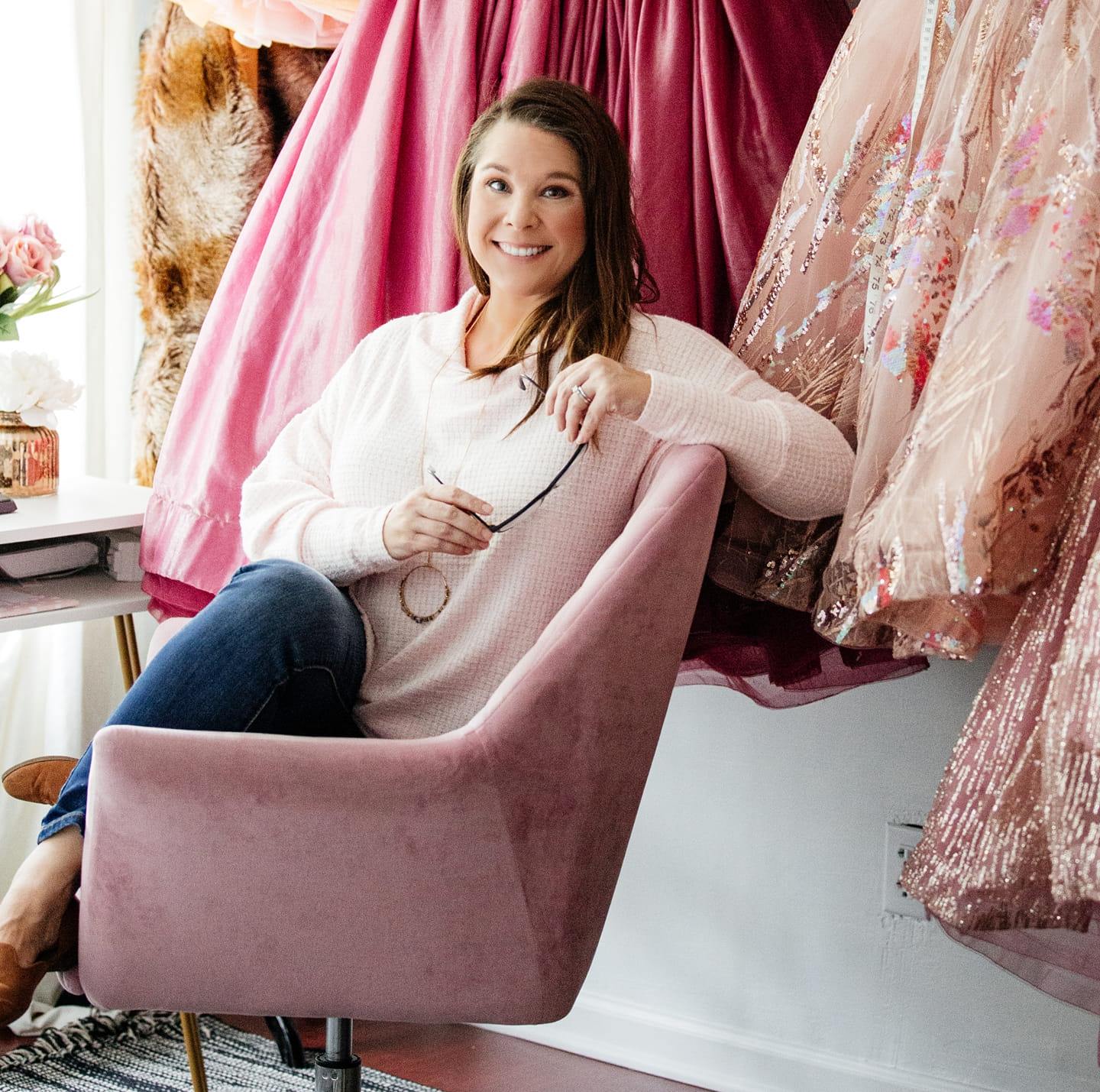 Elizabeth Copeland, designer of couture girls' gowns, showcasing her vibrant, detailed designs that bring luxury and elegance to every special occasion.