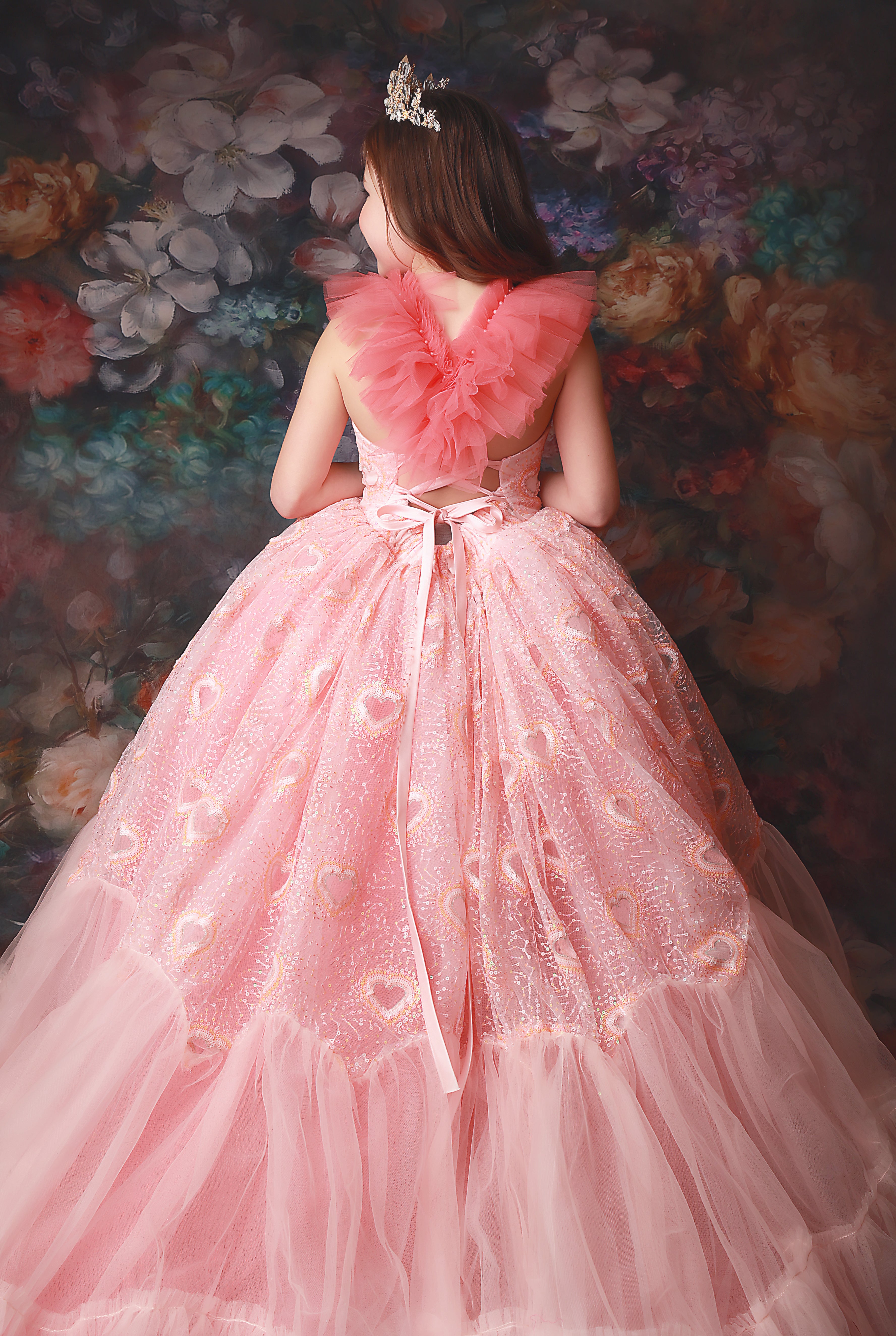 From dreamy silhouettes to intricate details, our couture gowns redefine childhood glamour.