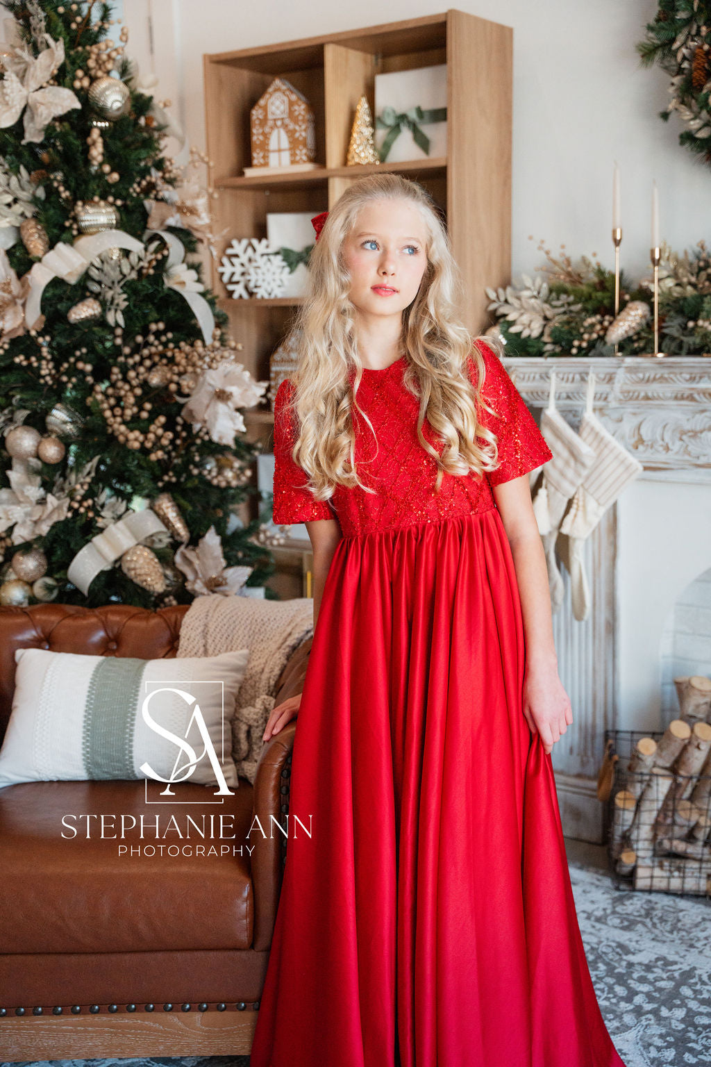 Full-length view of child modeling the Scarlet Sparkle gown with confidence