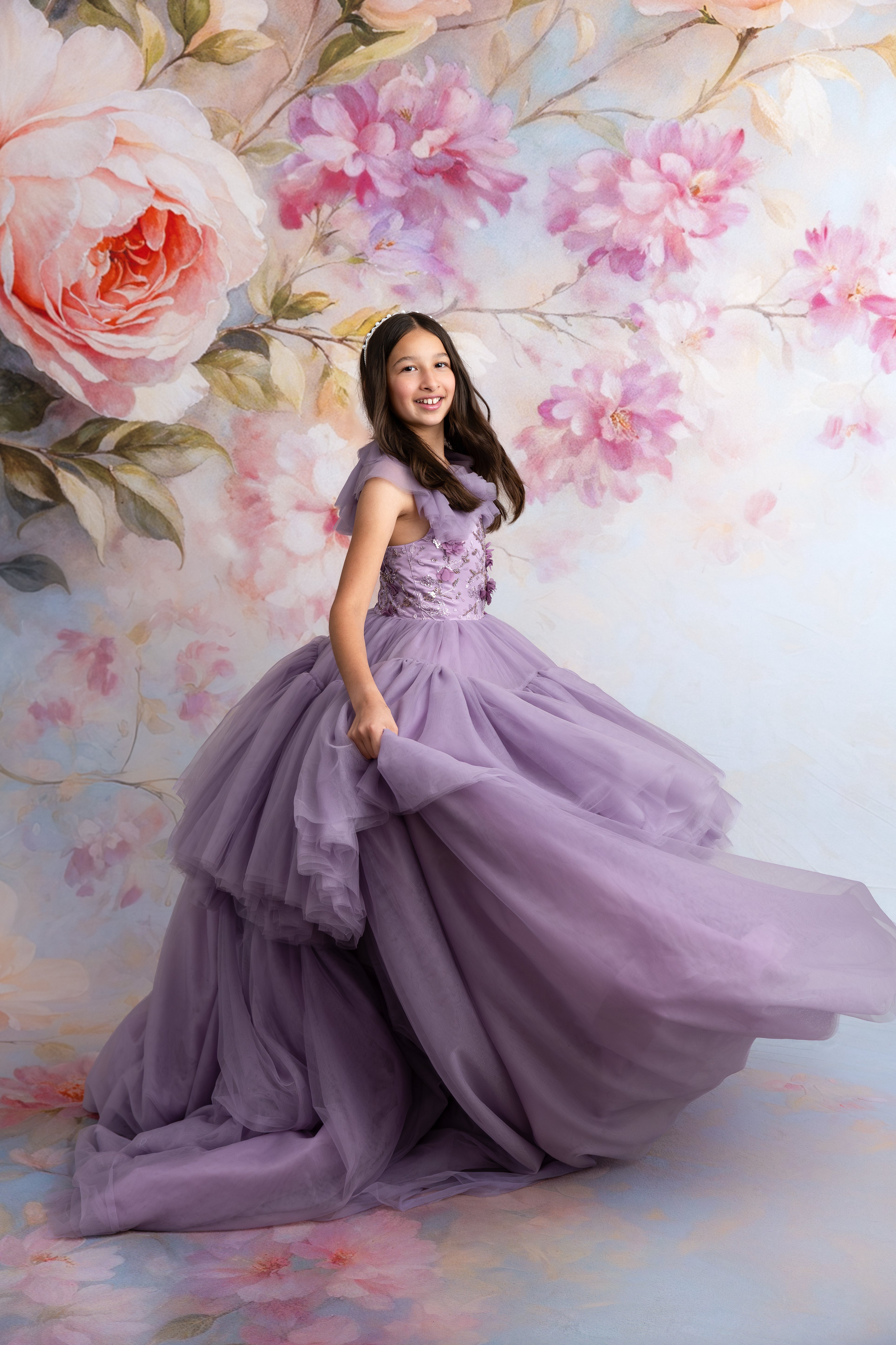 Side profile of Violet Grace gown with ruffled tulle shoulders and matching wrist cuffs