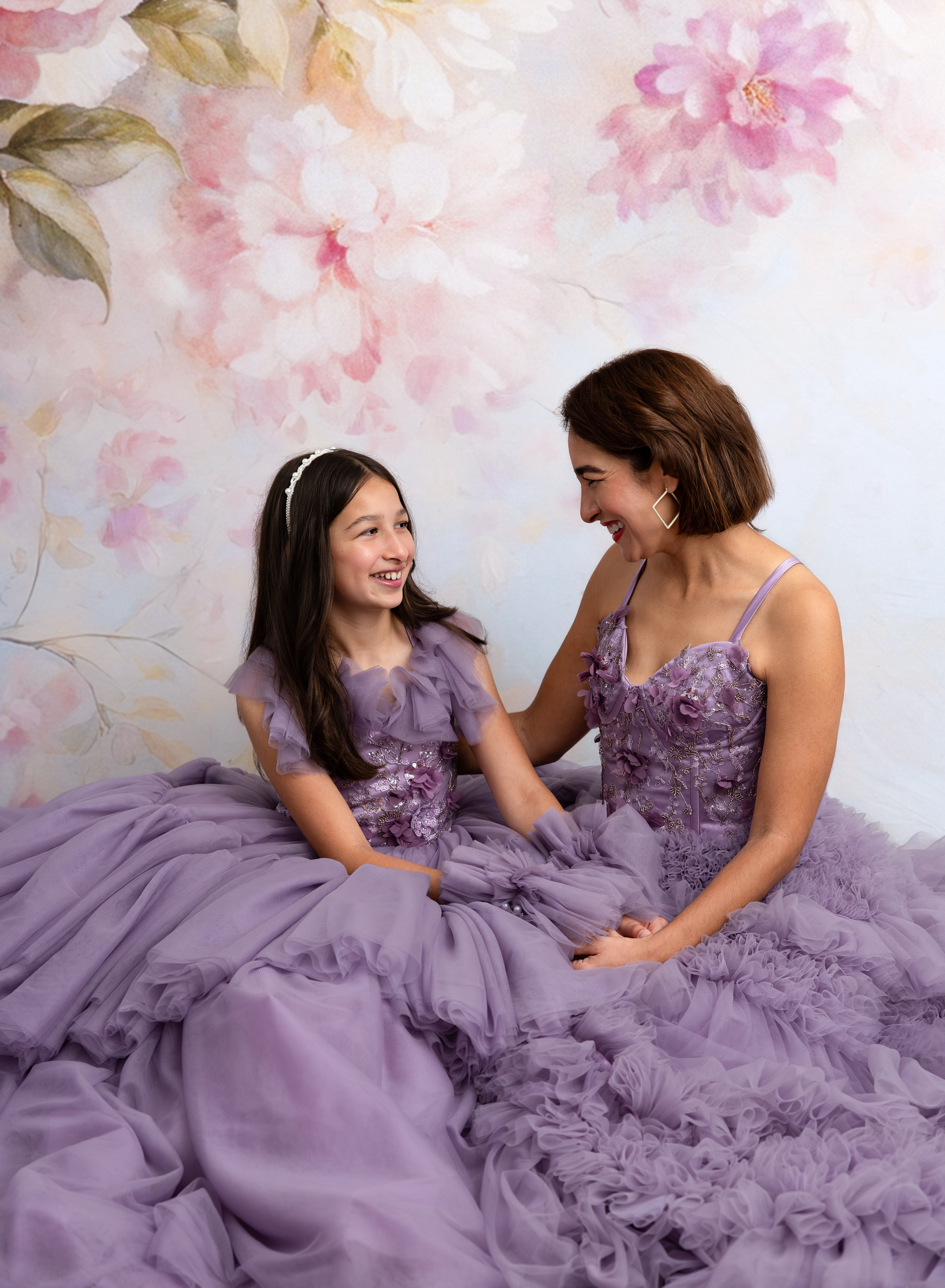 Detail of delicate embroidery and soft ruffles on Violet Grace Mommy and Me gowns