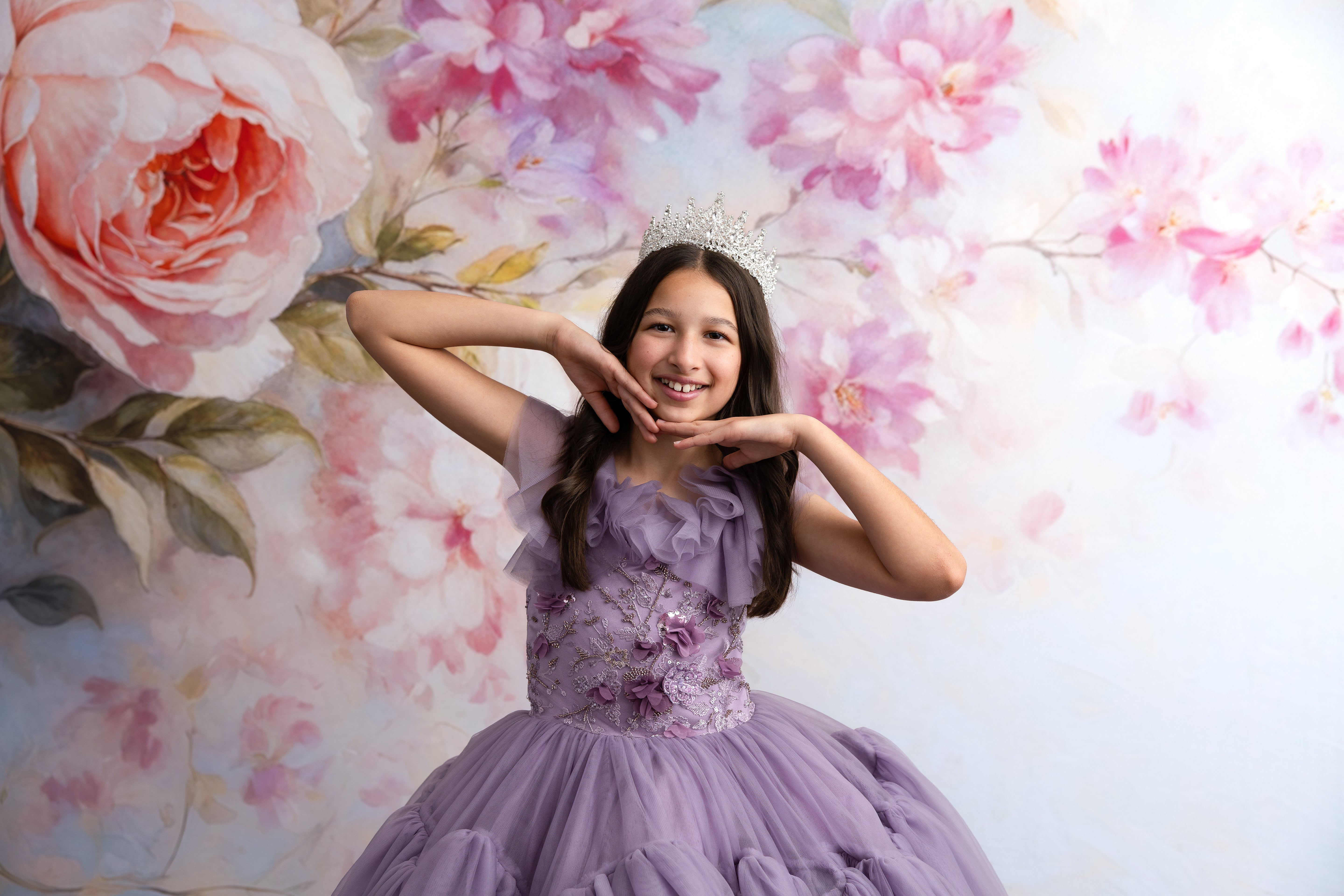 Portrait of girl wearing Violet Grace gown with delicate tulle shoulder ruffles