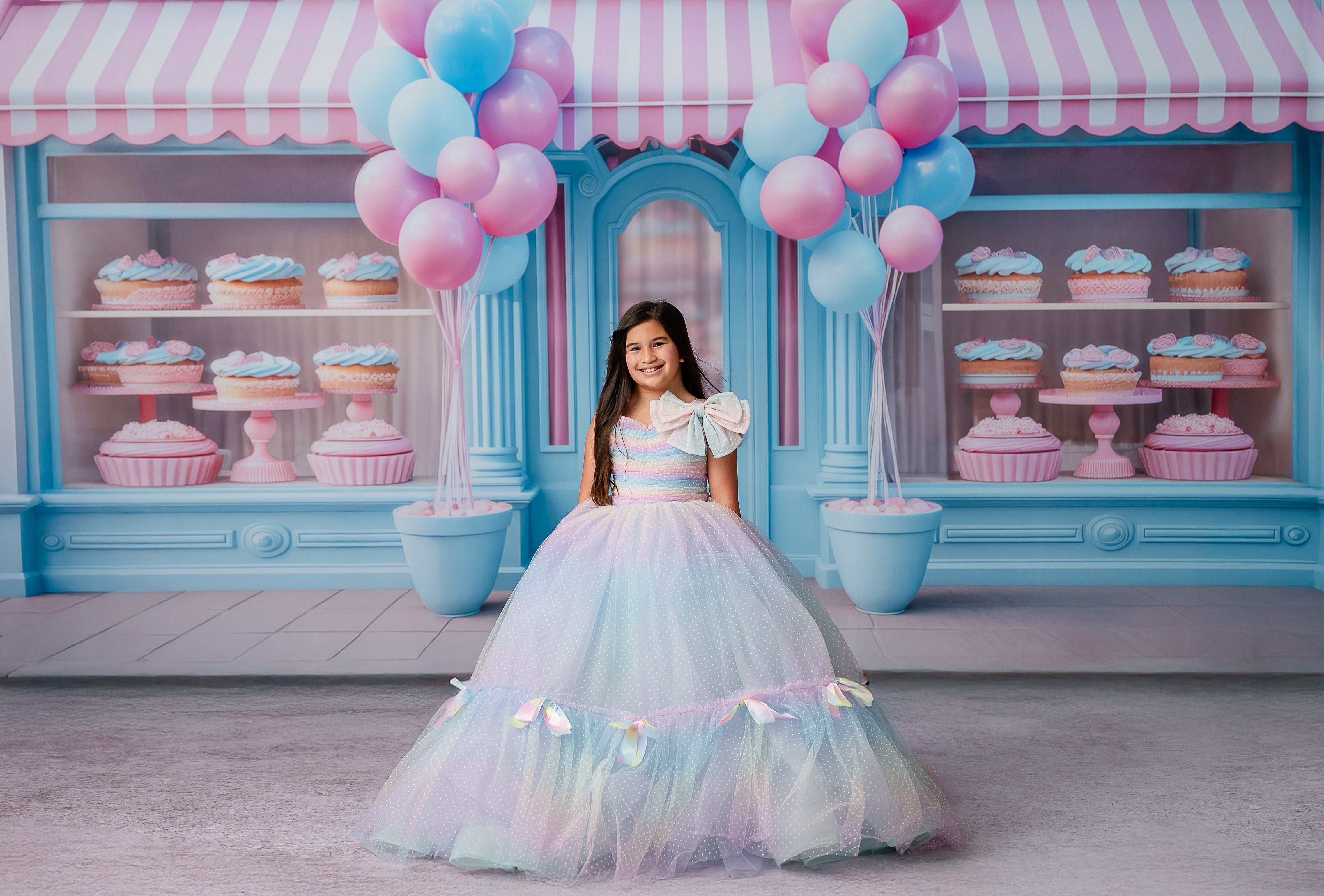 Twirling motion shot of a child in the Colorful Bliss Gown, emphasizing the fullness and floaty silhouette of the tulle skirt.