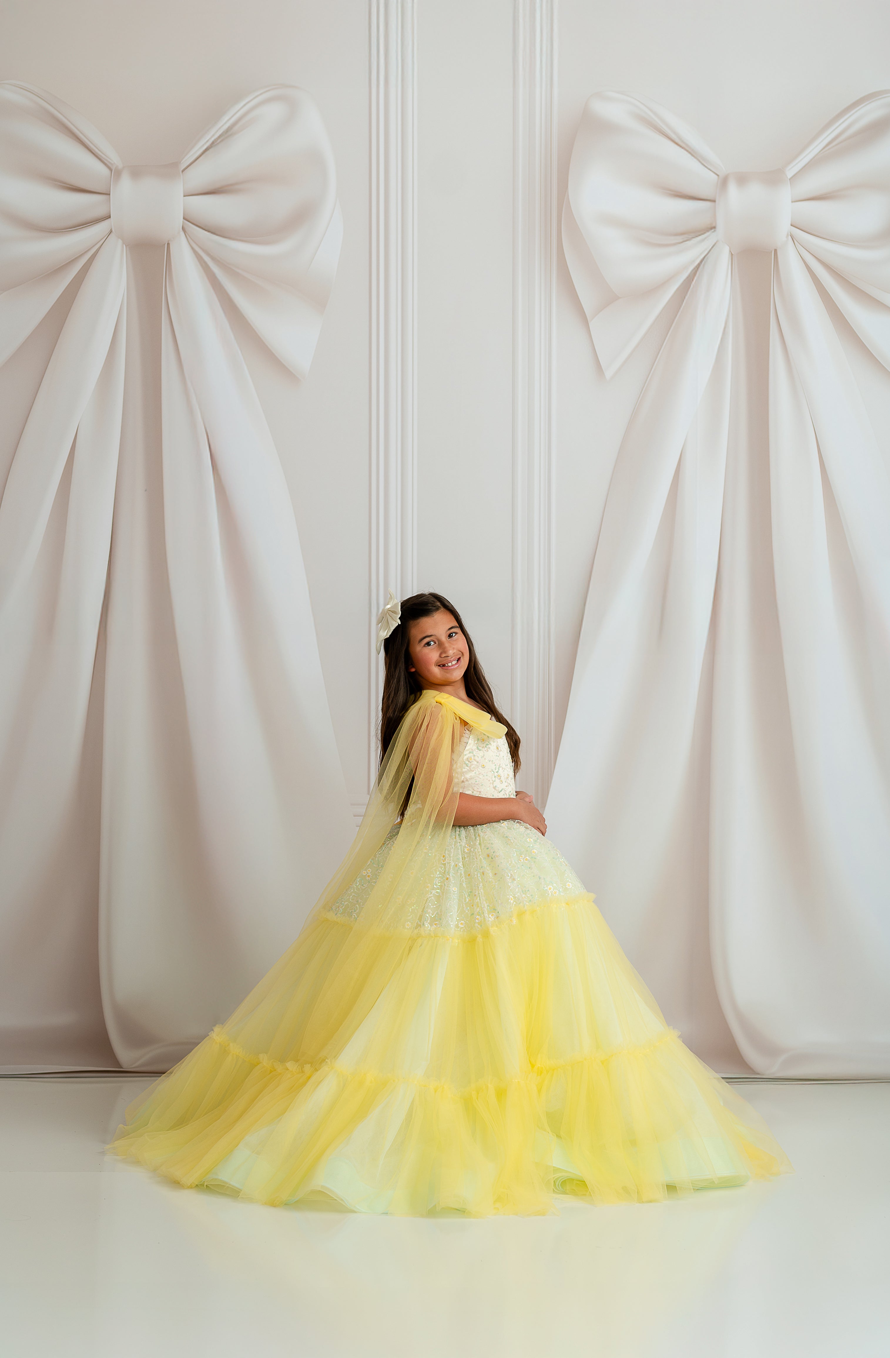 Harmony gown’s layered tulle skirt flowing in a dreamy spring photo shoot