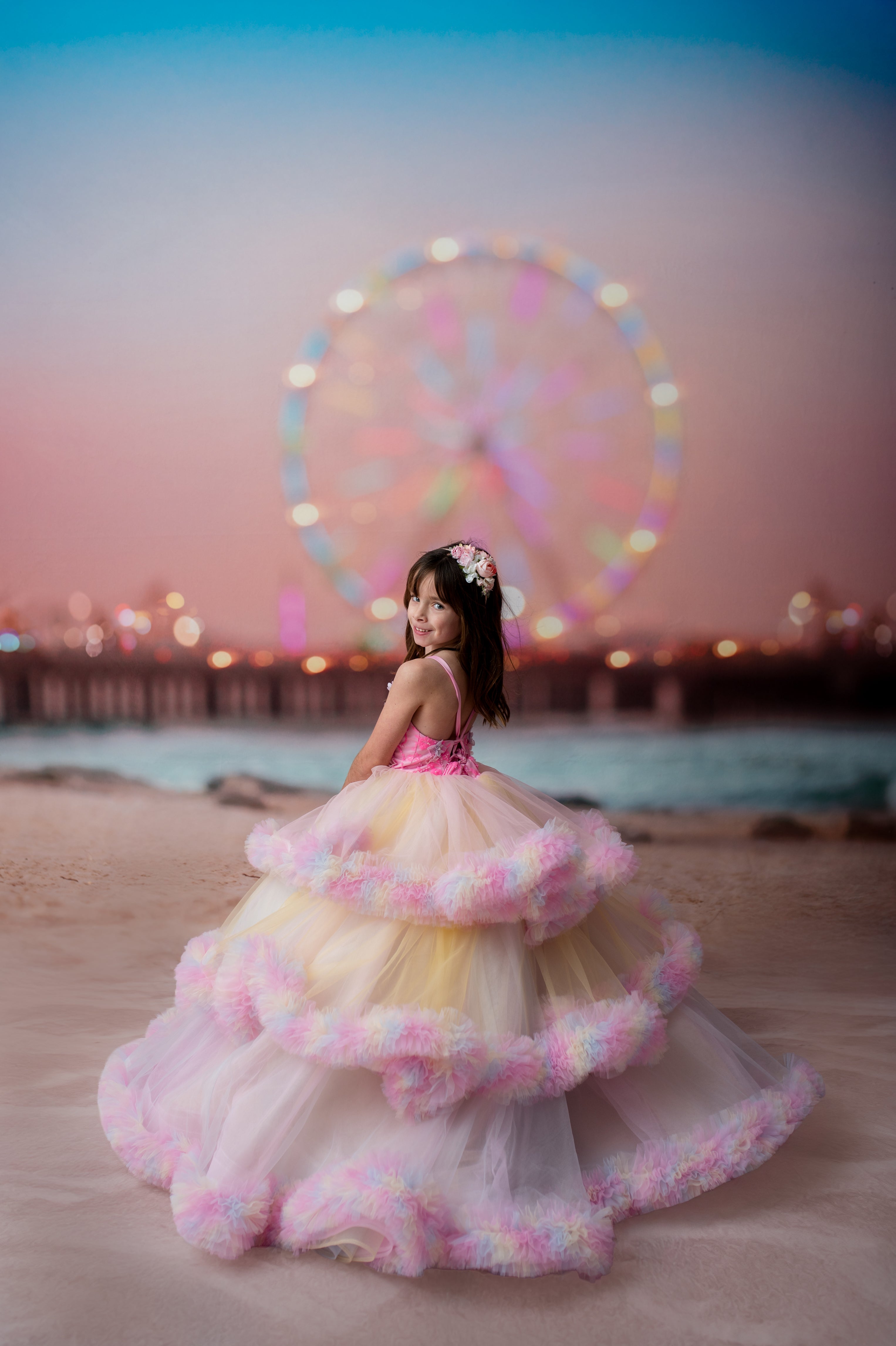 Woman in a colorful dress with a Ferris wheel in the background