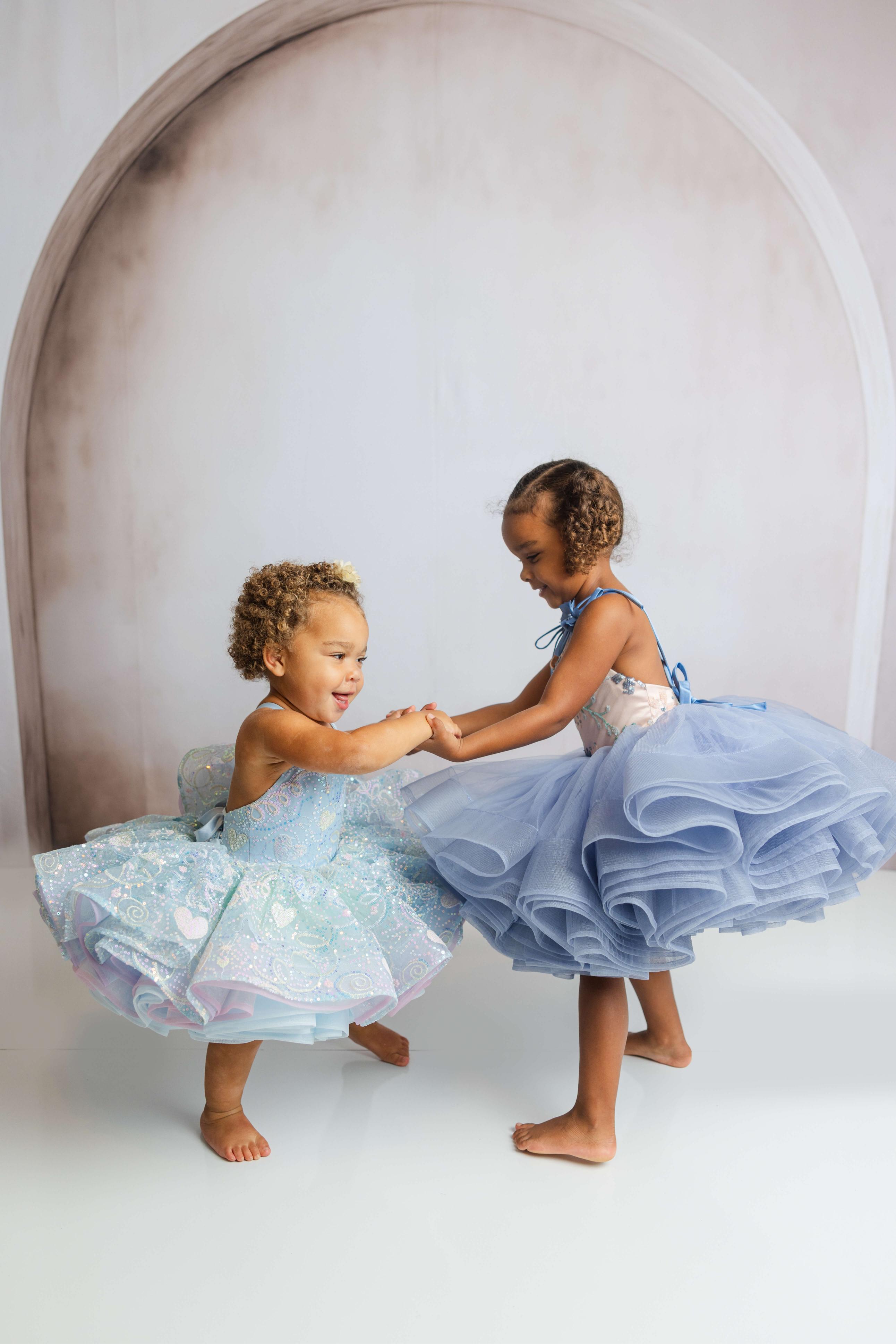 Petal-length dress for kids with pastel ombre skirt and flexible tie-up back.
