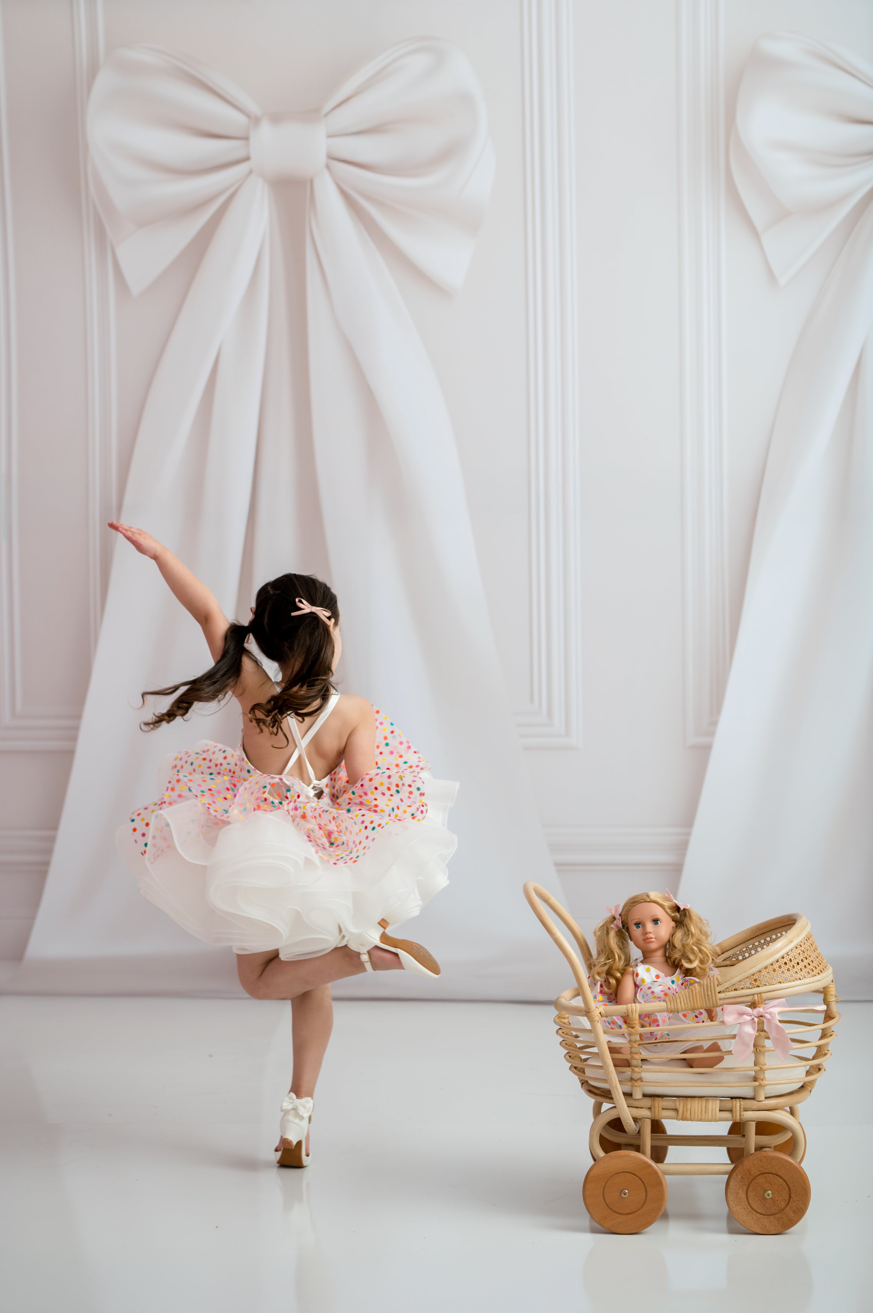 Polka dot girls dress with sweetheart neckline photographed on mannequin