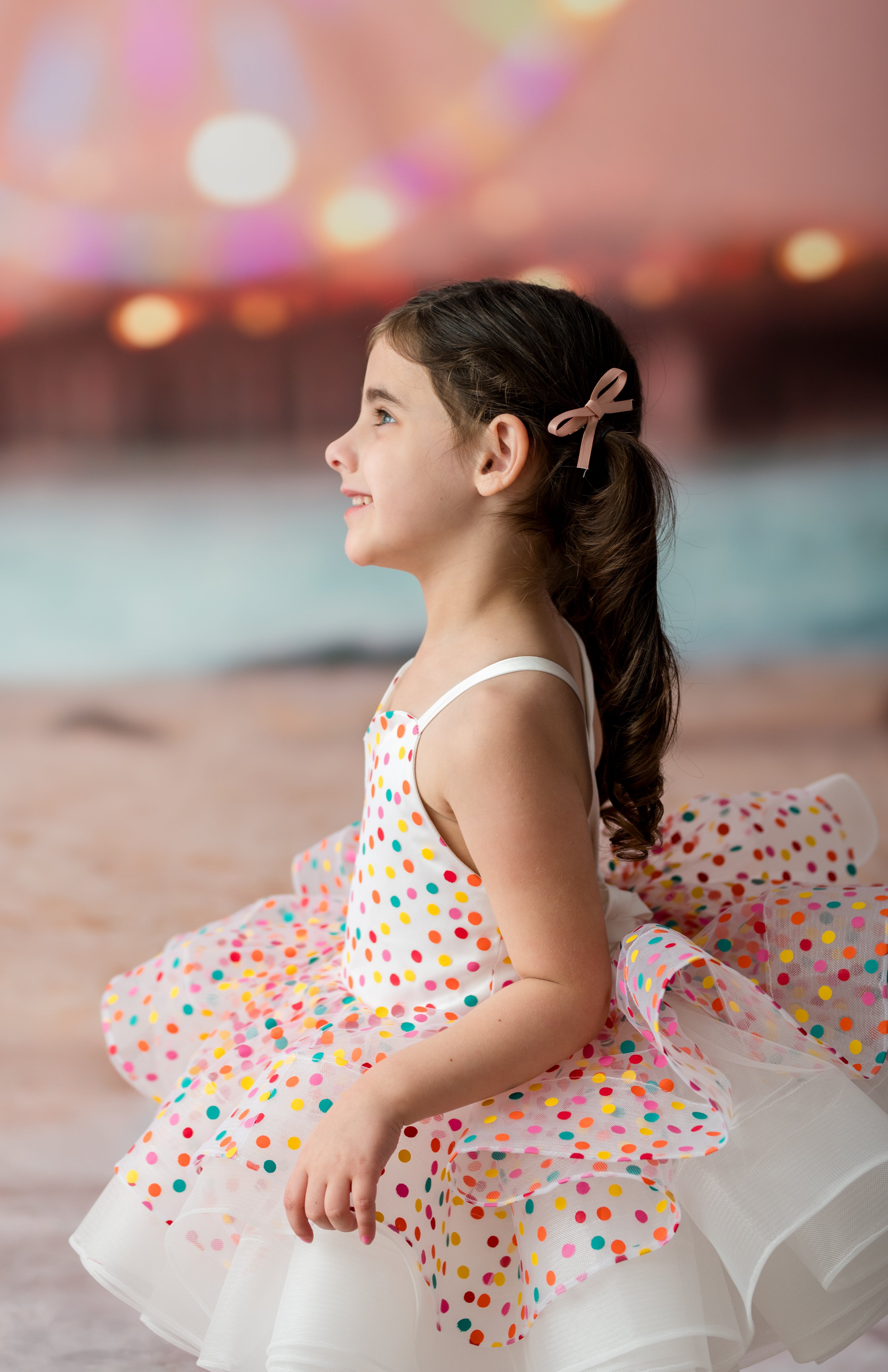 Heirloom-style children’s tutu dress on mannequin with white satin shoulder straps