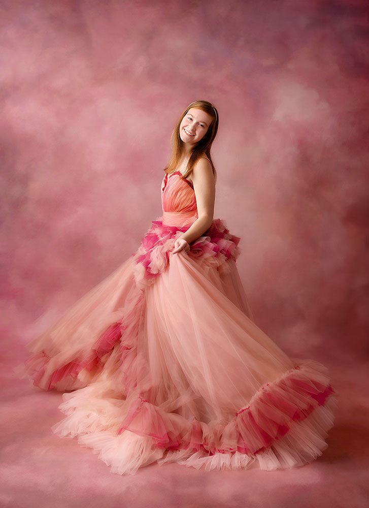Beautiful young girl in a couture custom and rental gown, featuring intricate designs and luxurious fabrics, perfect for special occasions and photography sessions.