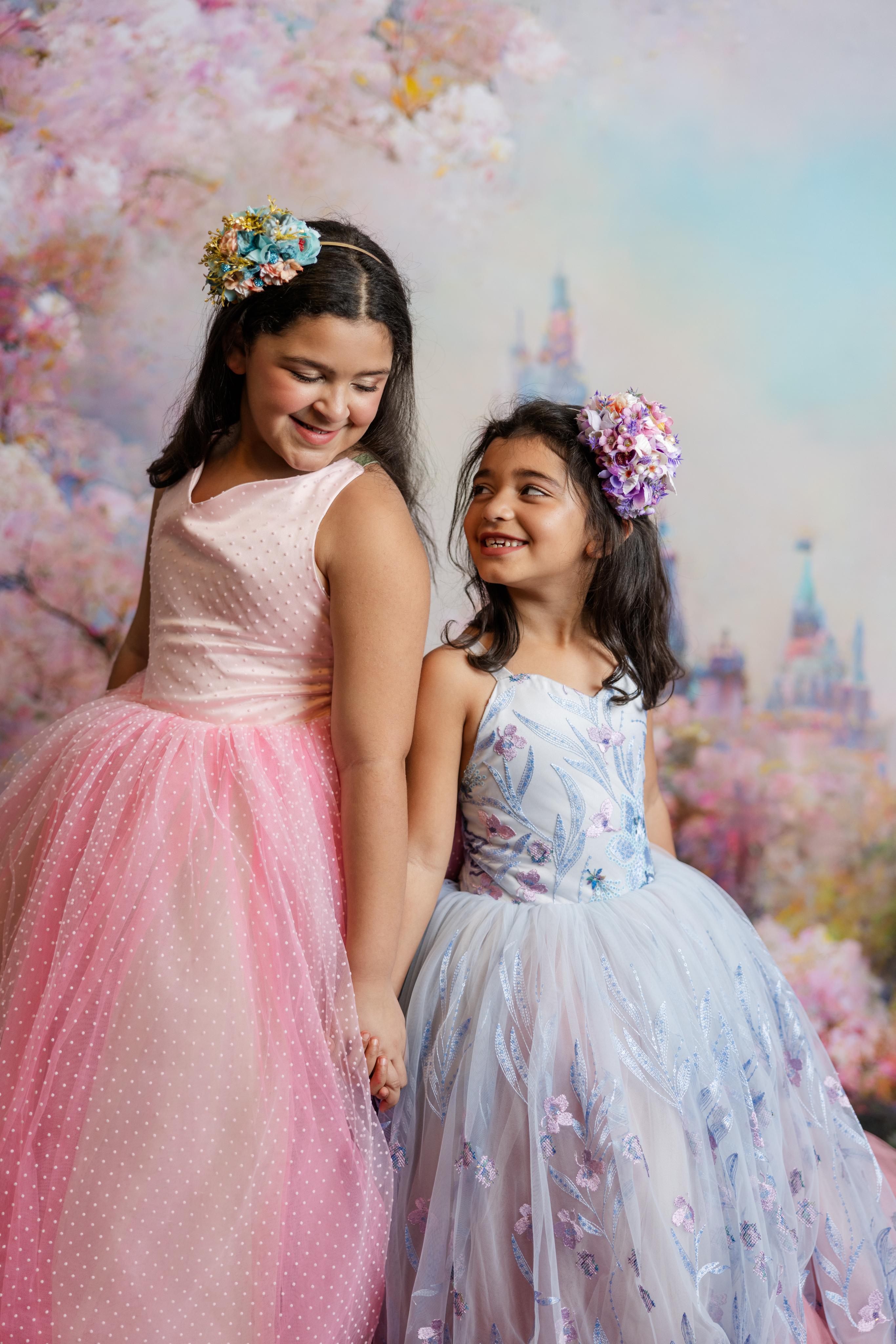 "Savannah Bloom gown with its floor-length design, perfect for capturing the elegance of young princesses in photos."