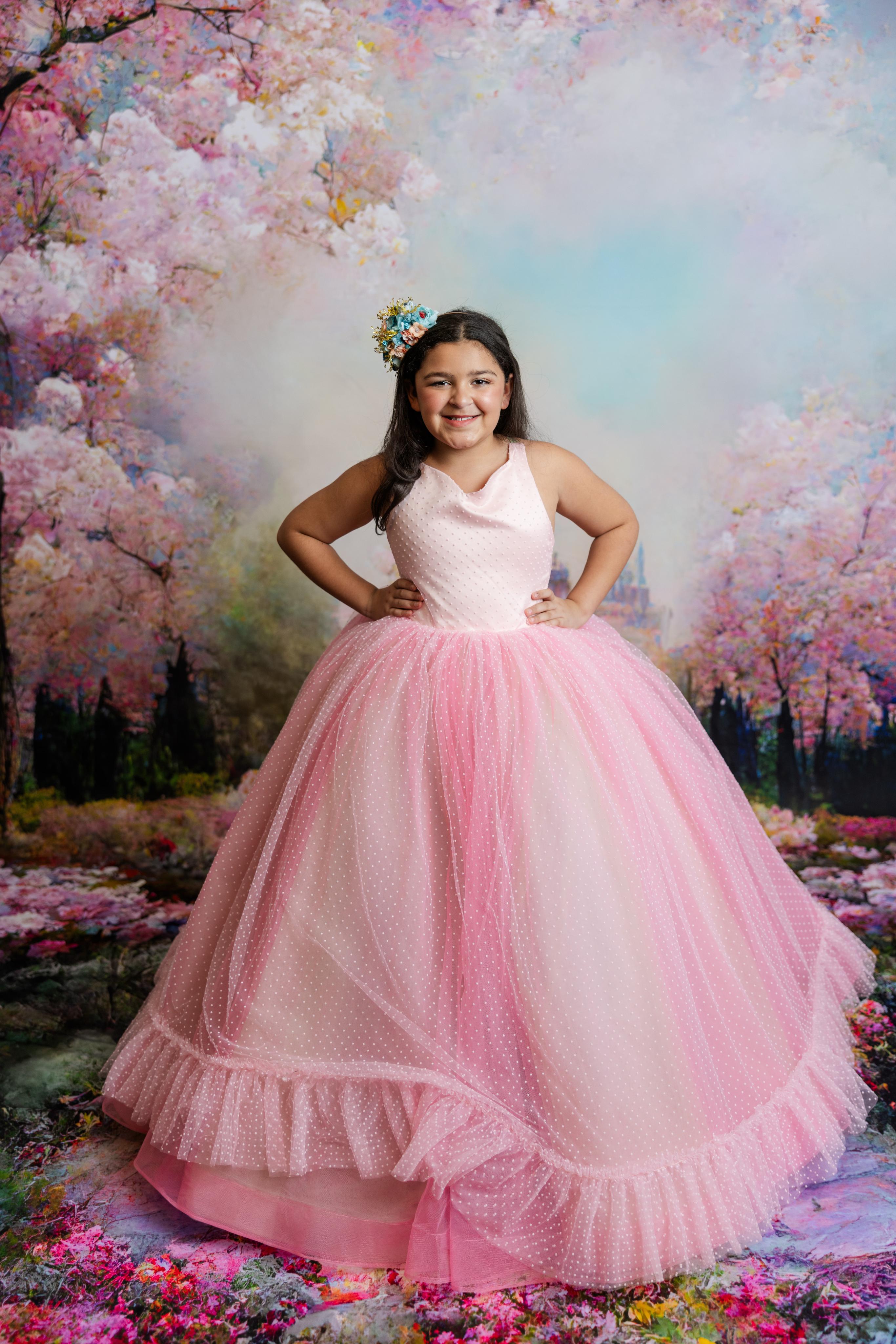 "Detailed view of the soft pastel layers in the Swish Dot Couture gown, showcasing shades of pink, sage, and soft blue bridal tulle."