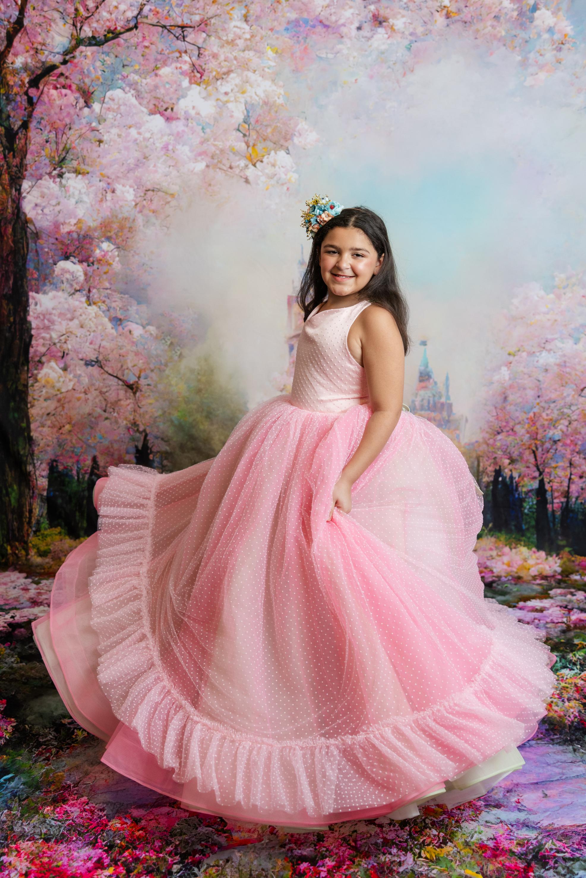 "Close-up of the delicate pink Swiss dot fabric on the Swish Dot Couture gown, highlighting the intricate texture."