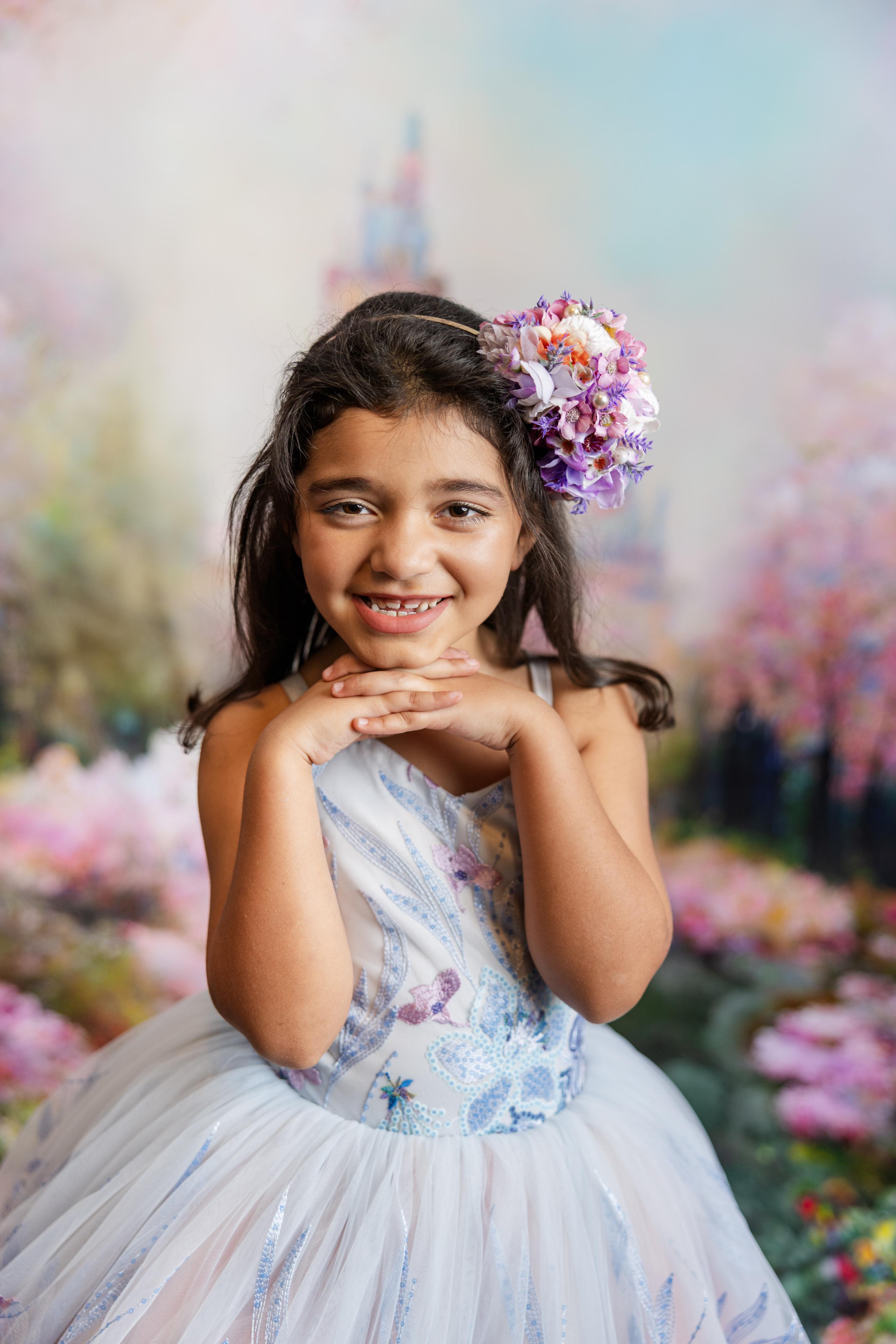 "Savannah Bloom gown featuring intricate lace accents and a sparkling floral sequin design, ideal for ages 6-9."