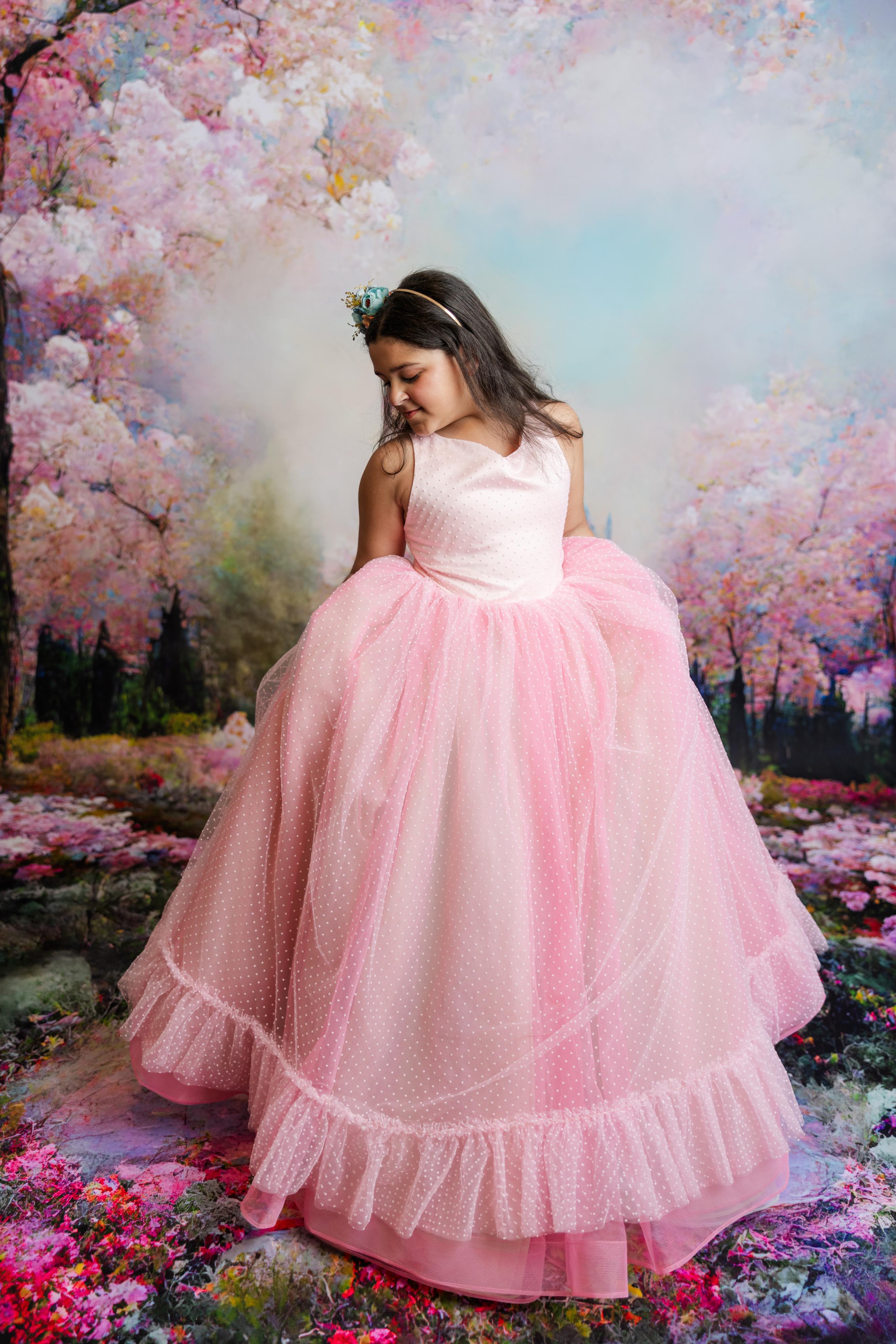 "Swish Dot Couture Pastel gown featuring adjustable shoulder ties and an elastic waistband for a comfortable, customizable fit."