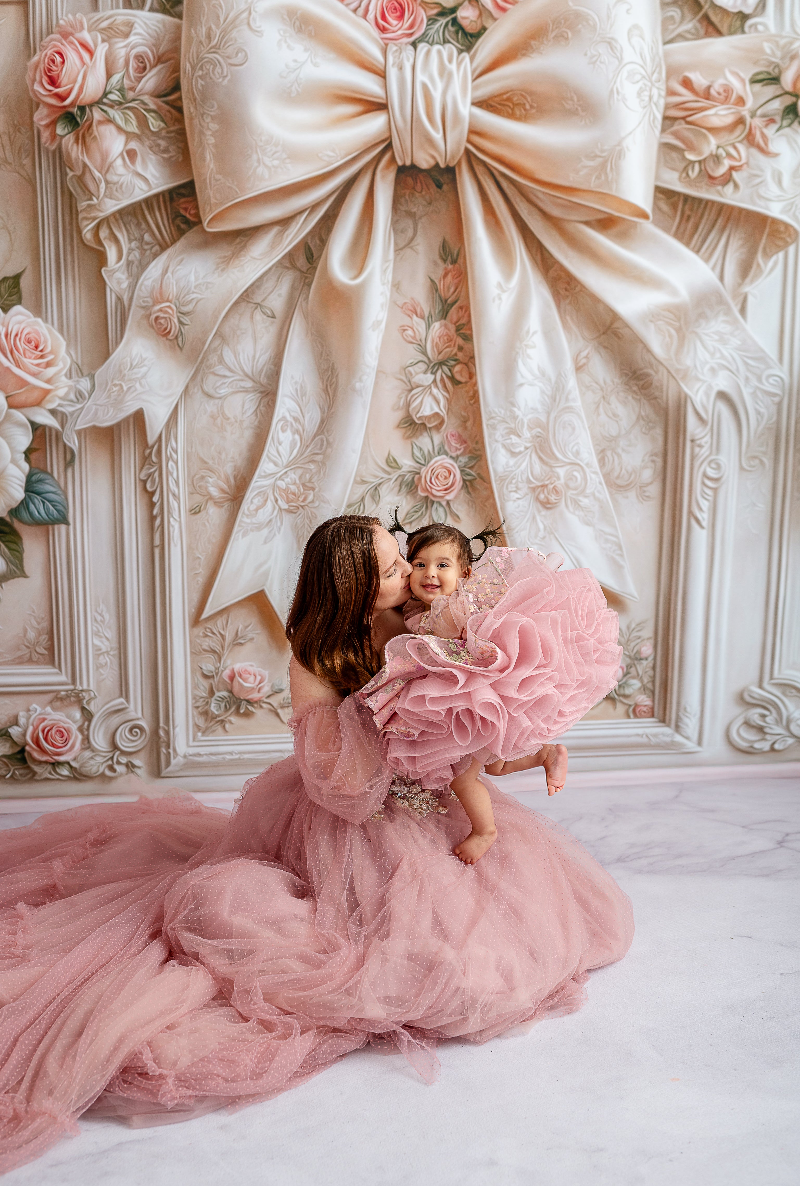 Mom and baby in matching designer gowns for a fairytale look