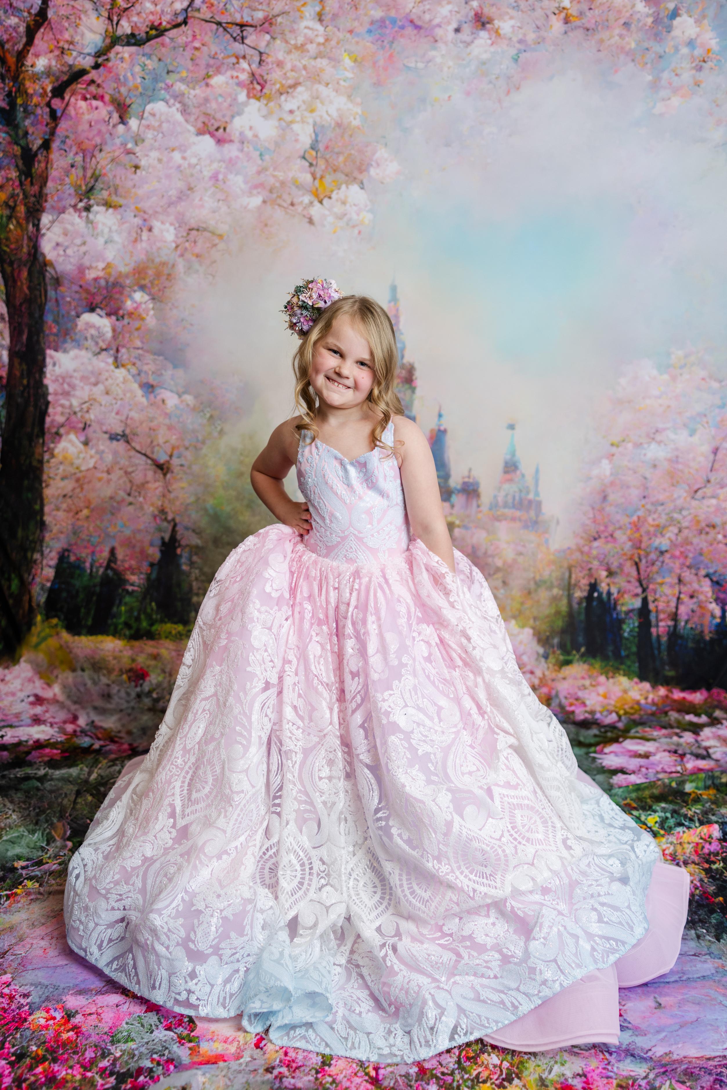 "The Sugar Kisses gown in full-length, with a beautifully flowing skirt and detachable off-shoulder sleeves for versatile styling."