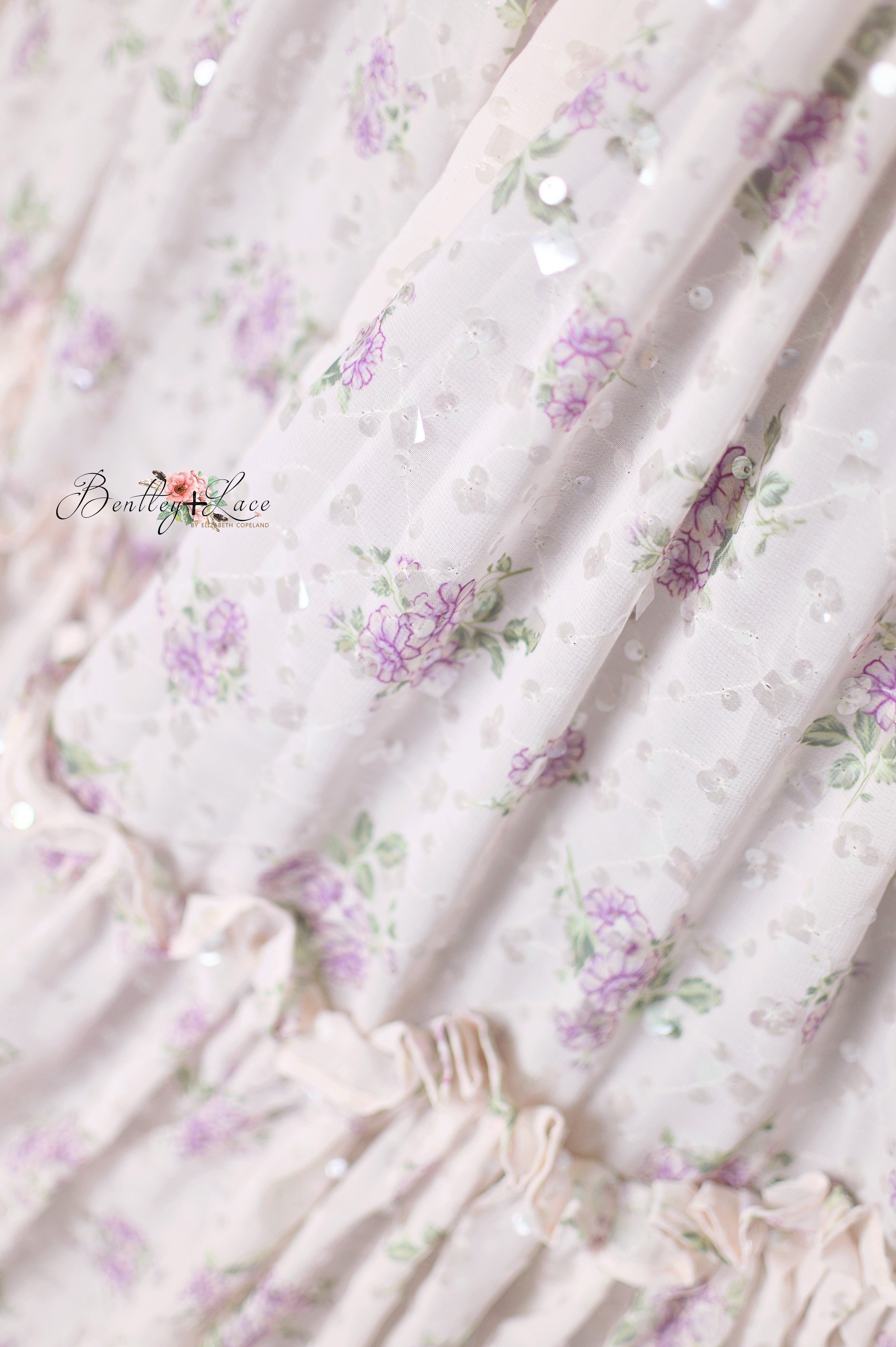 Whispering Serenade gown close-up showing floral details and subtle sparkle.