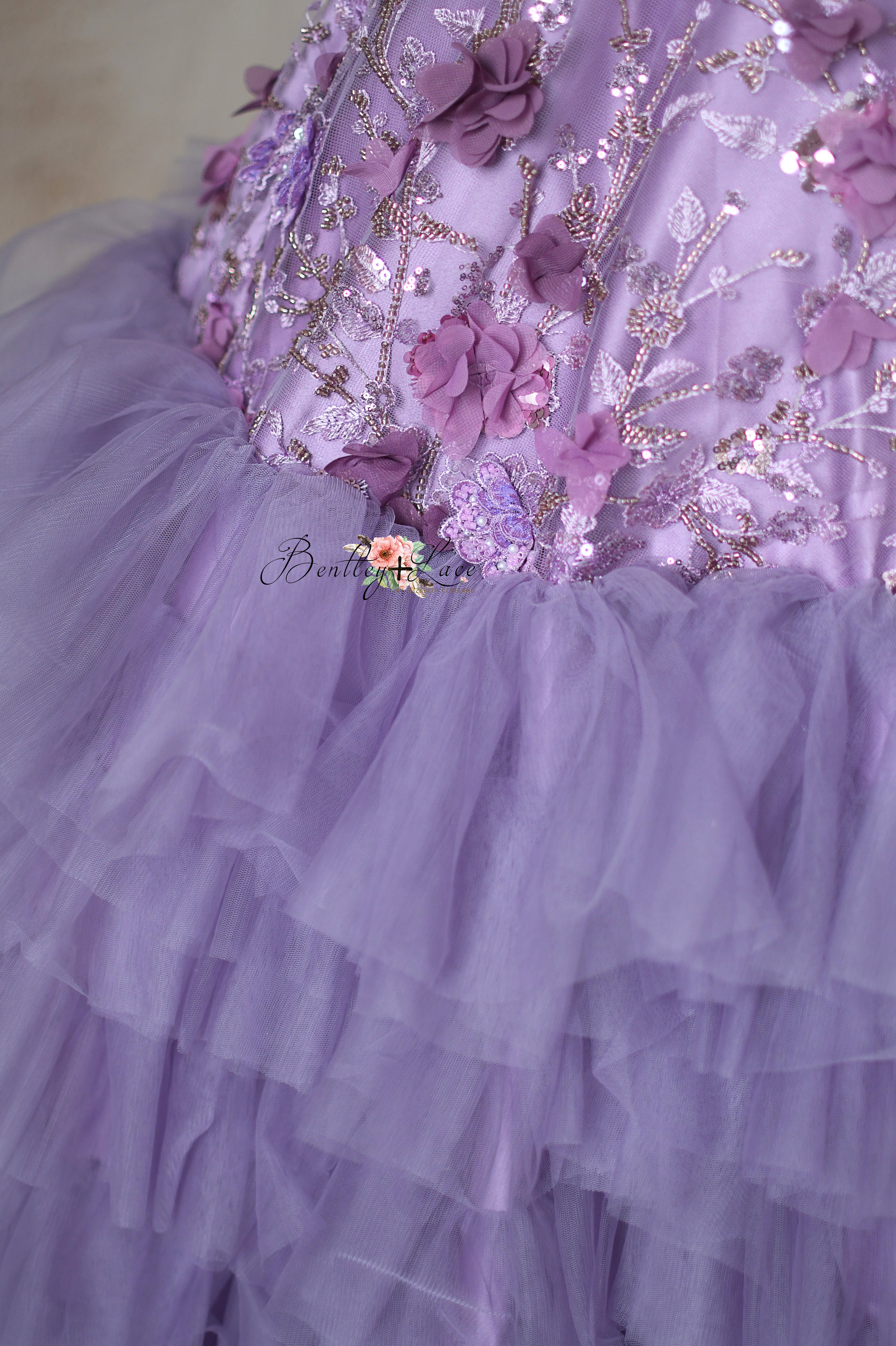 Layers of ruffled tulle on the Violet Grace gown's voluminous skirt.