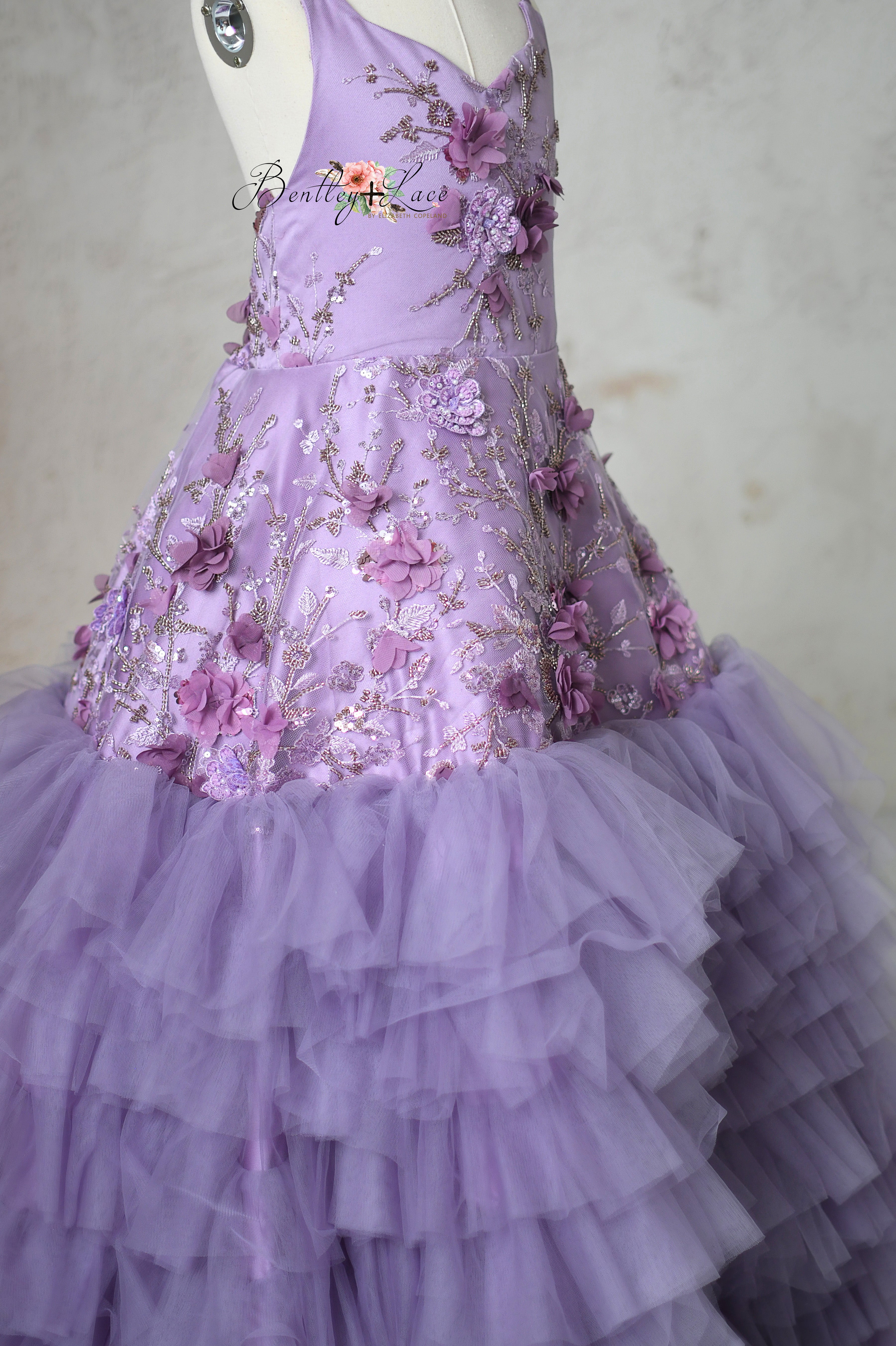 Detailed view of lavender sequin embroidery on the Violet Grace gown bodice.