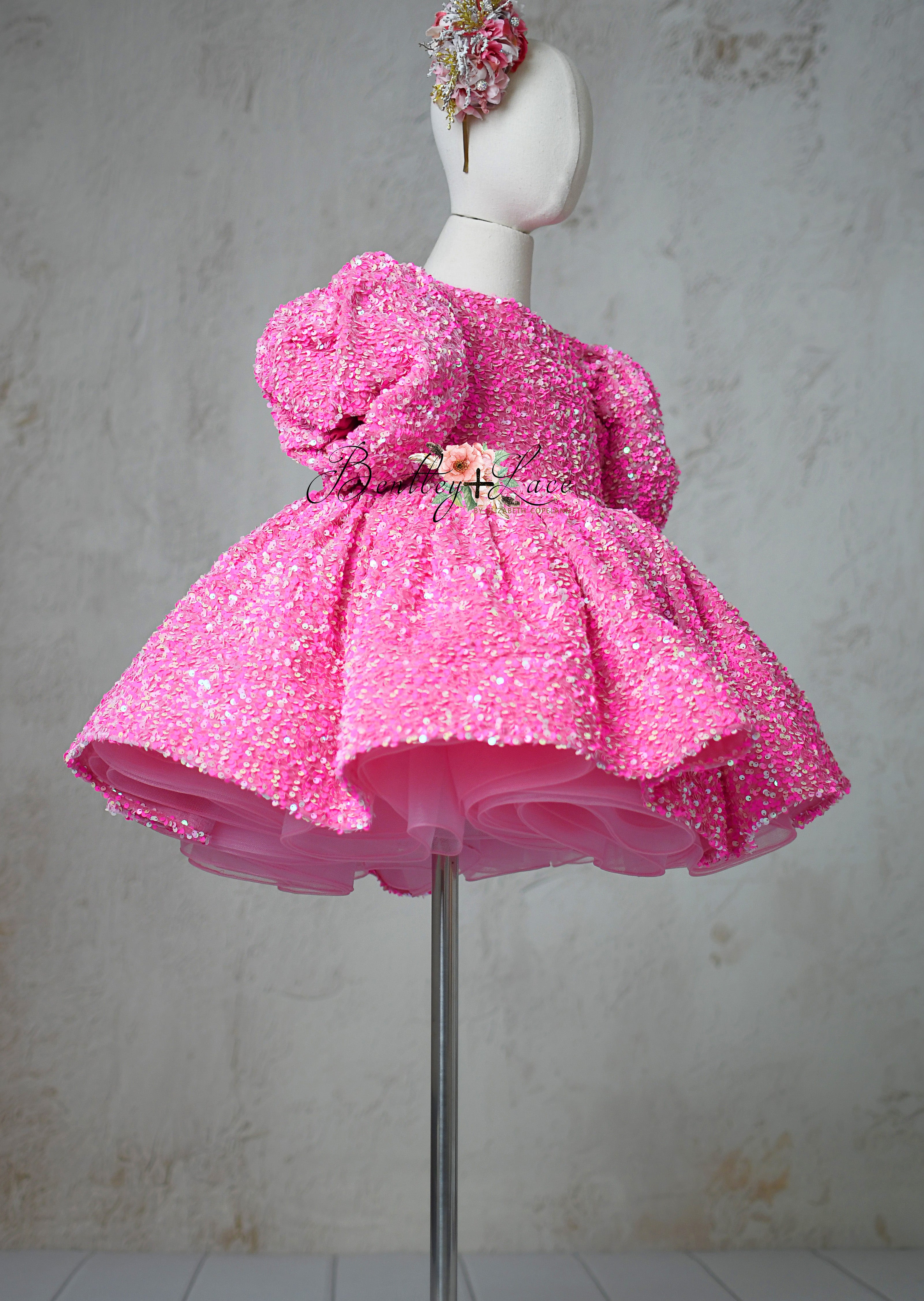 "Elegant pink sequin dress for 6-7 year olds with detachable puff sleeves, Retro Candy design."