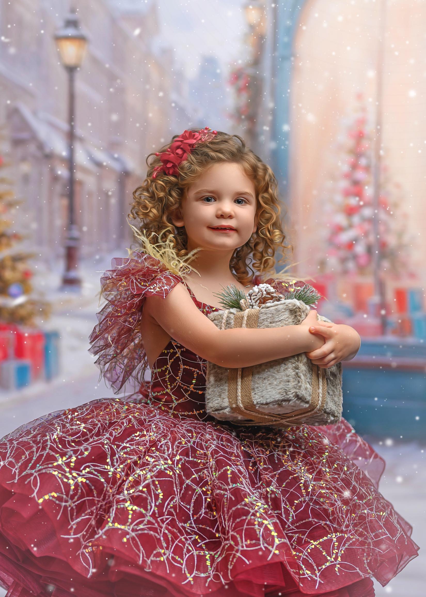 little girl wearing a sparkly burgundy holiday gown.