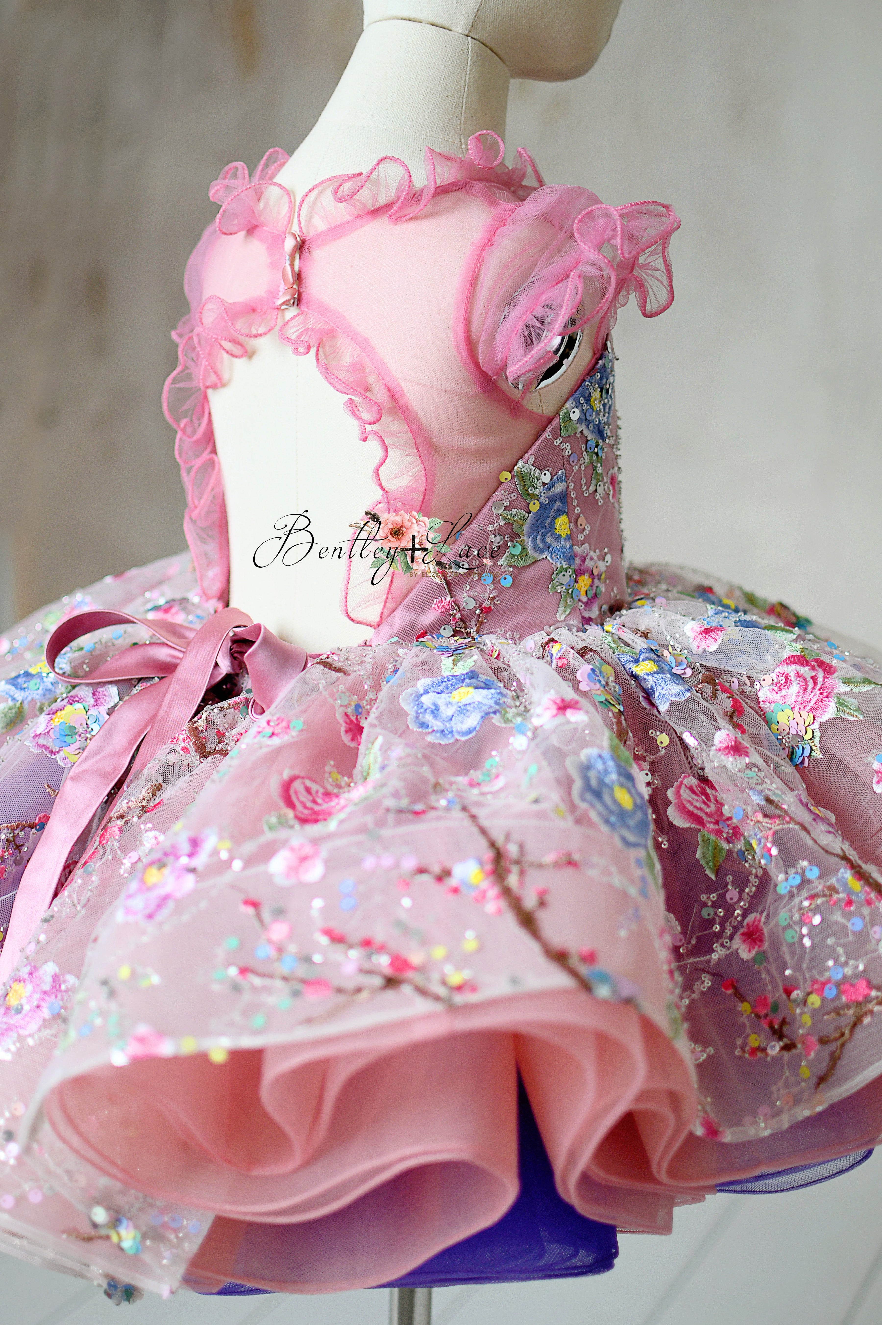 Close-up of the tulle fabric texture, showcasing the sequin cherry blossom design.