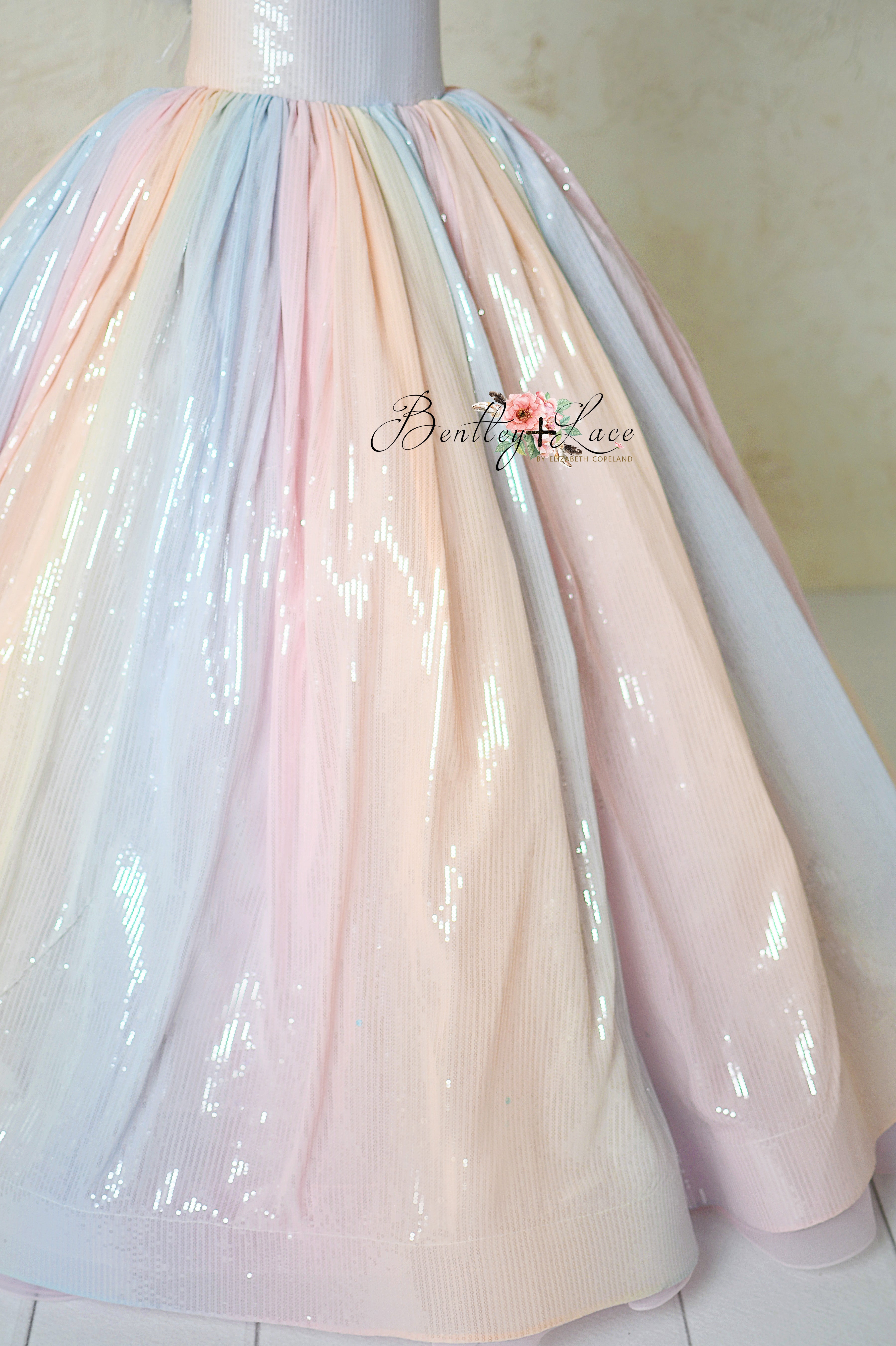 Soft, pastel ombré tulle skirt of Aurora Gleam gown with added volume from built-in crinoline.