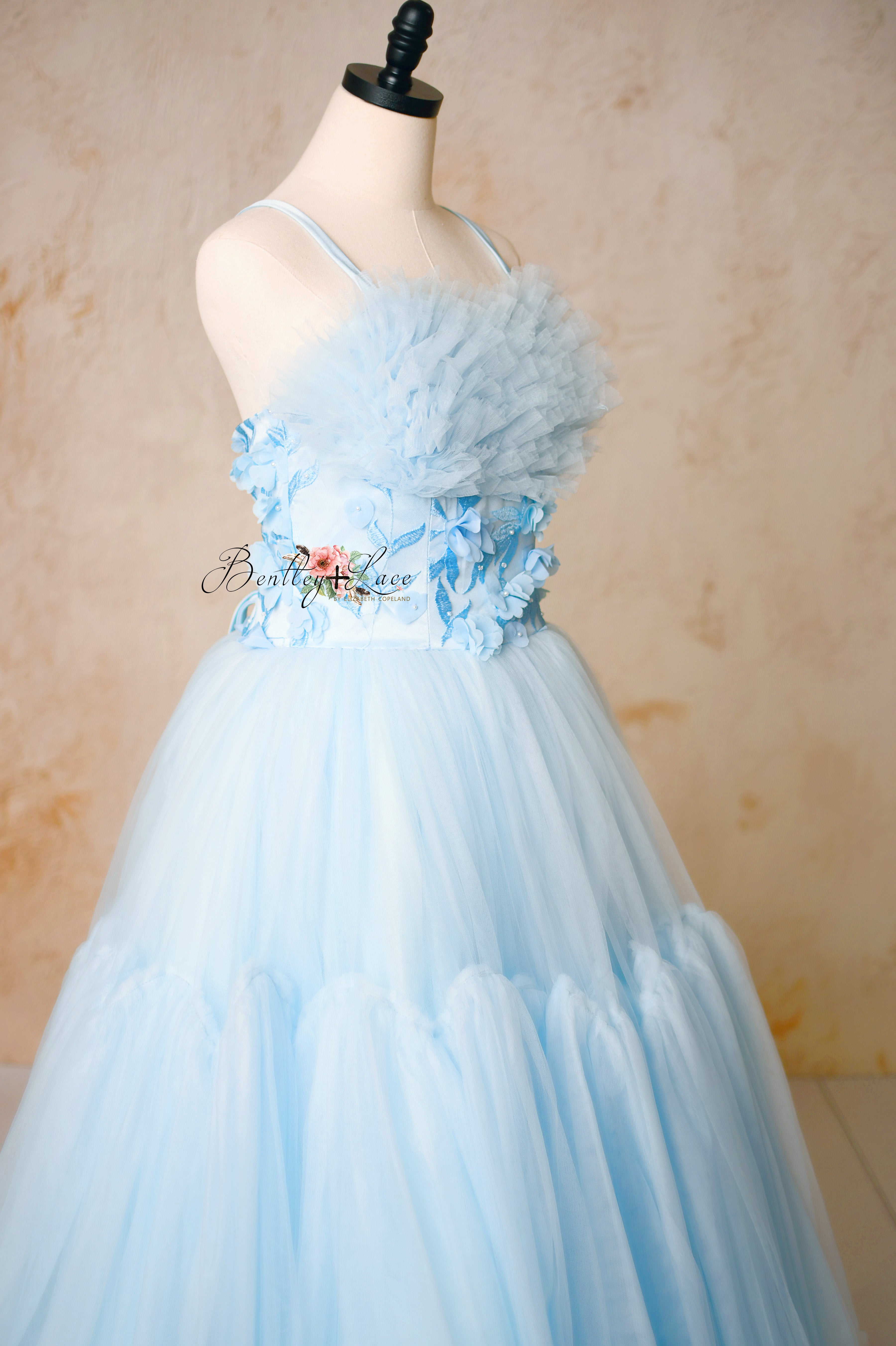 Delicate layers of soft tulle on the Heavenly gown, creating a dreamy and ethereal look.