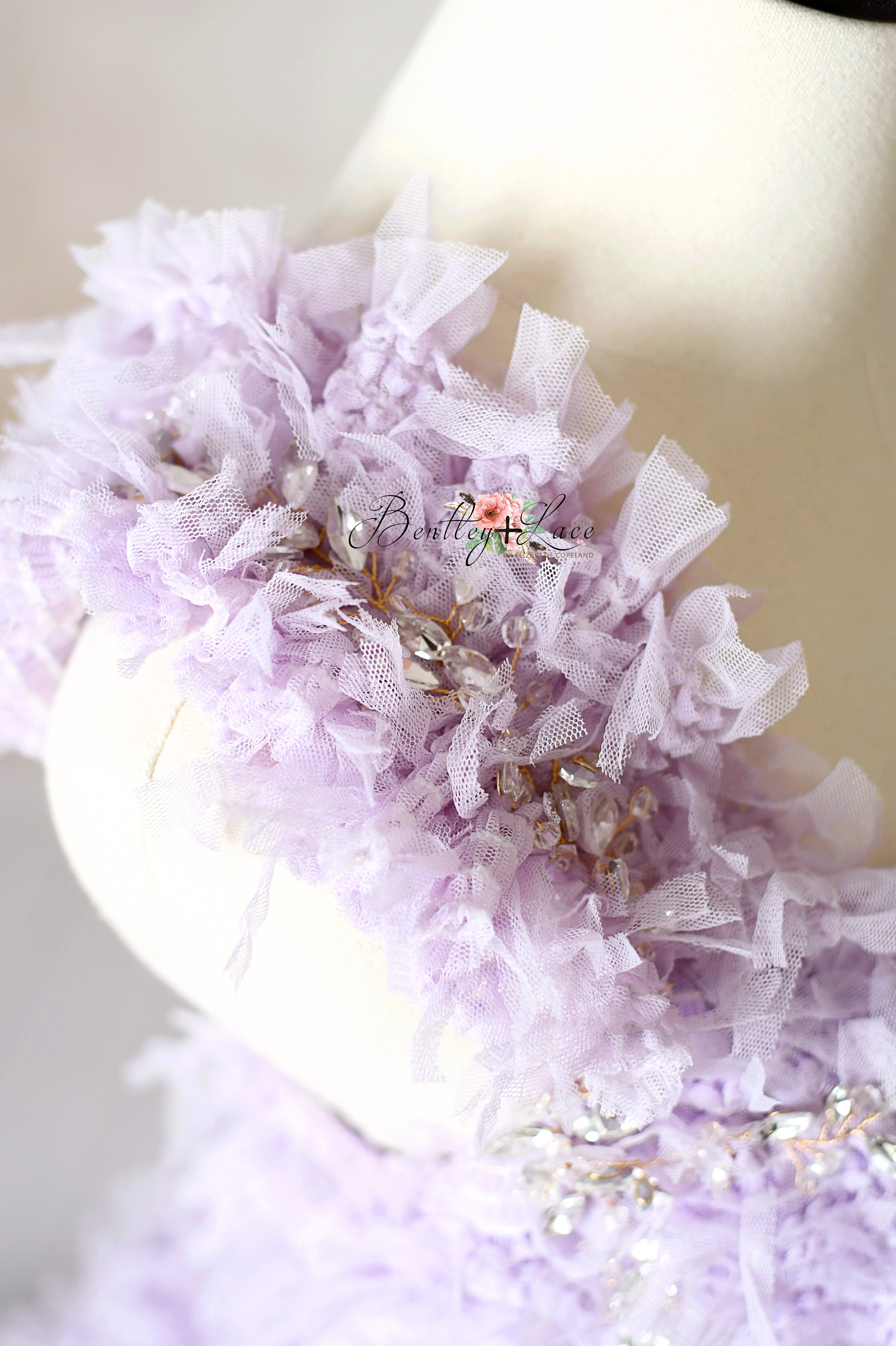Intricate mesh jacquard embroidery detail on the lavender couture gown.
