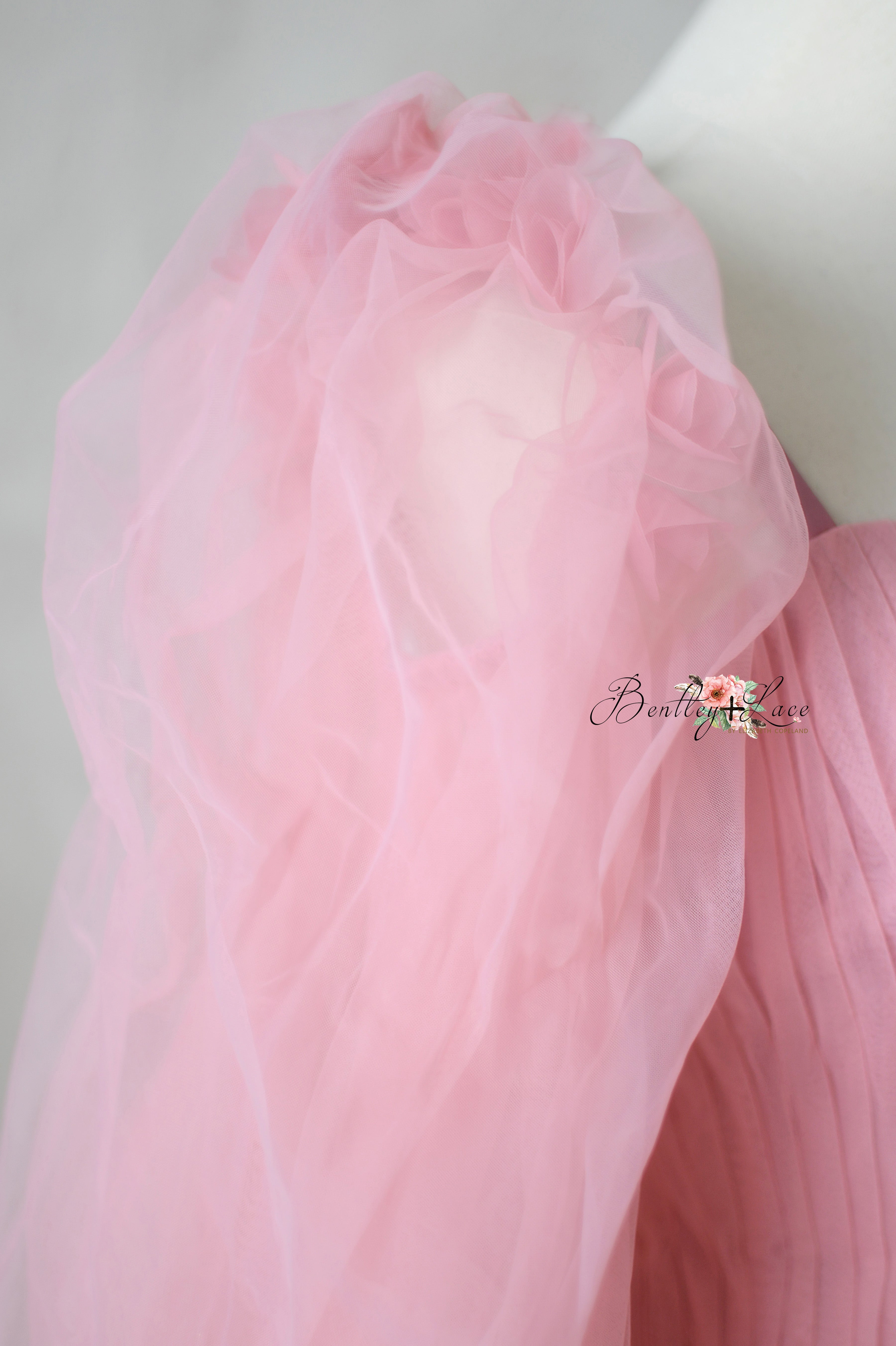 Detachable tulle sleeves on the Rosewater Radiance gown for a versatile daytime-to-evening look.