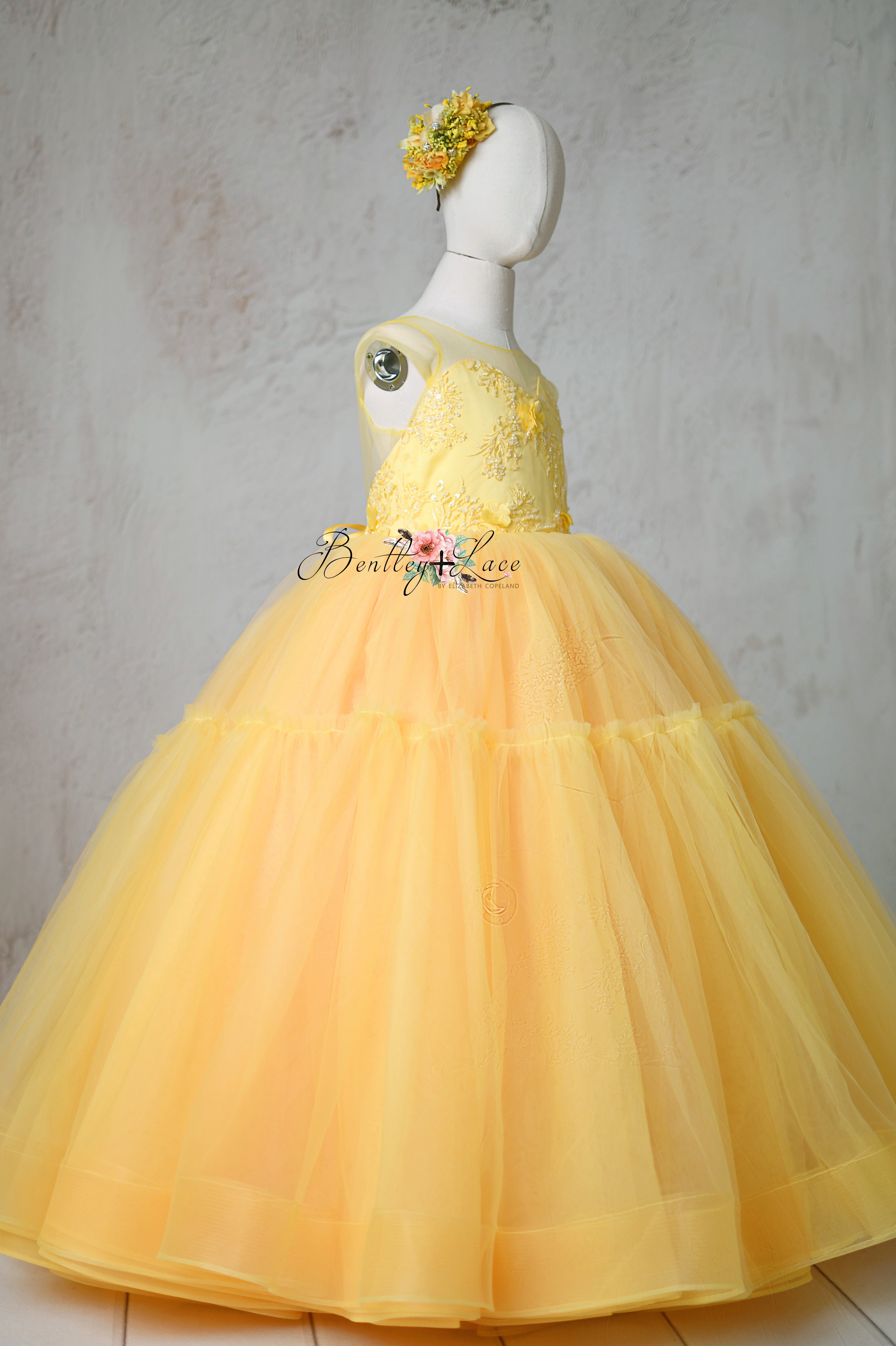 The Buttercup dress showcases a stunning open back with an elastic insert for a perfect fit.