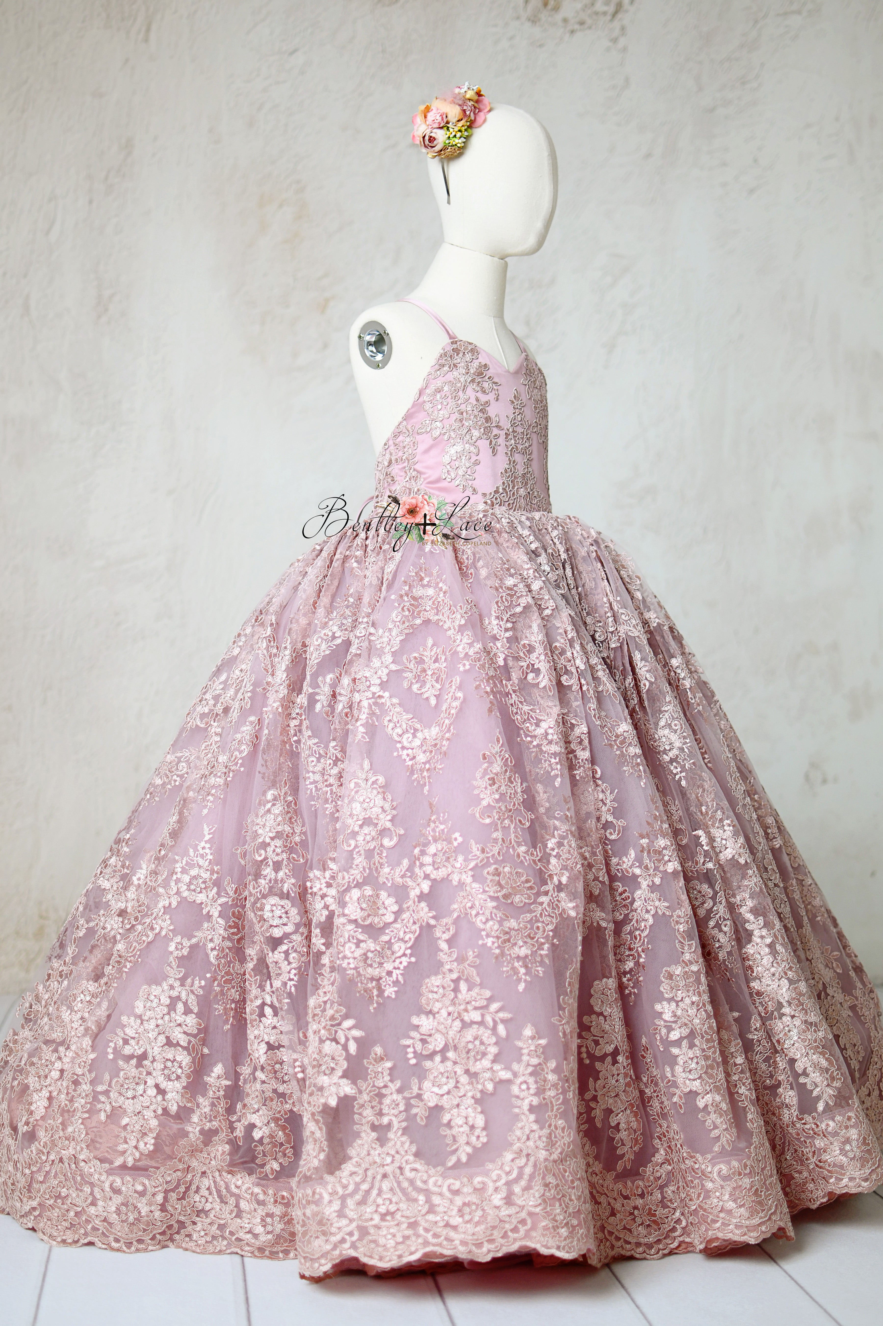 Dreamy couture gown with sparkling lace details, capturing timeless elegance and charm.